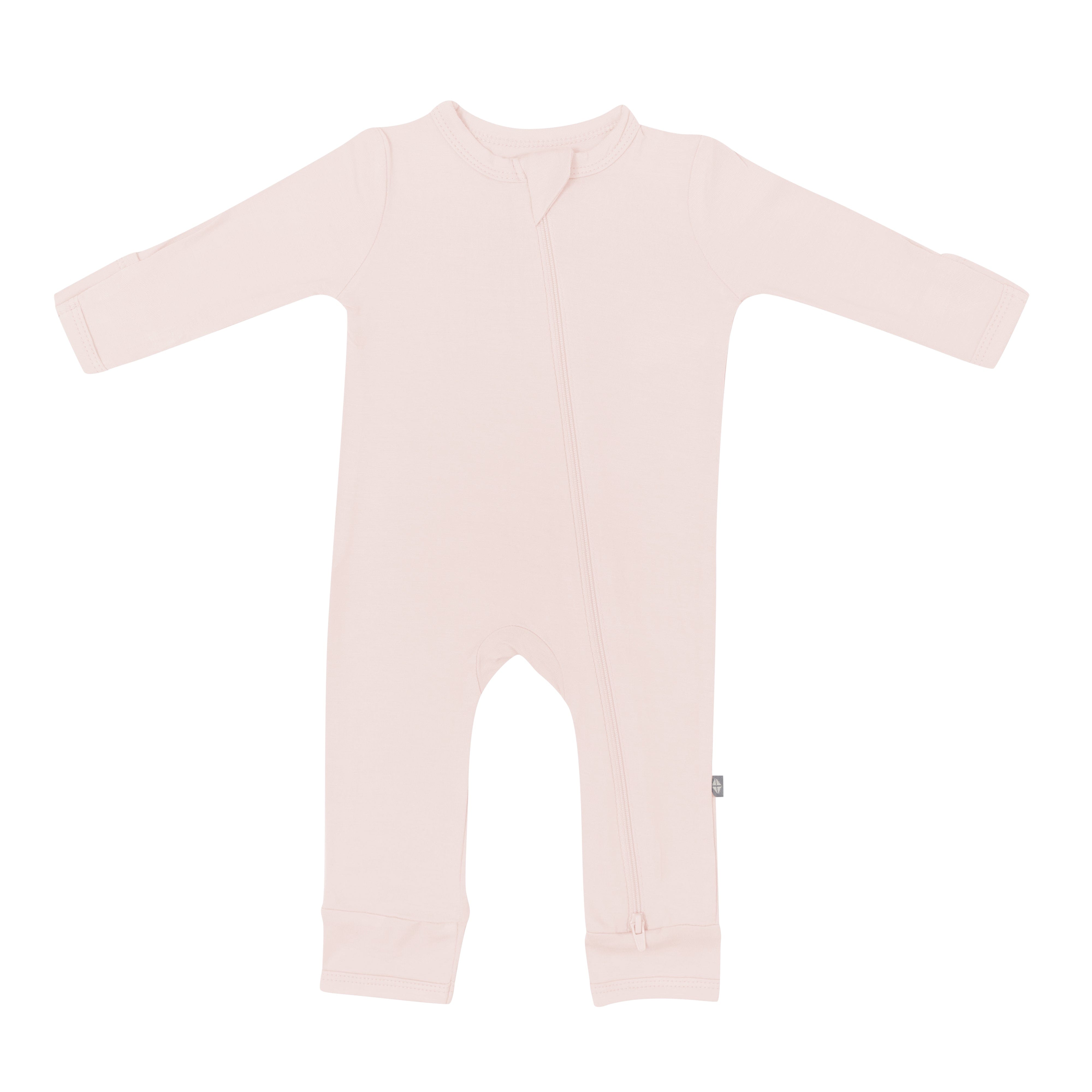 Flat lay of Kyte Baby Zippered Romper in Blush