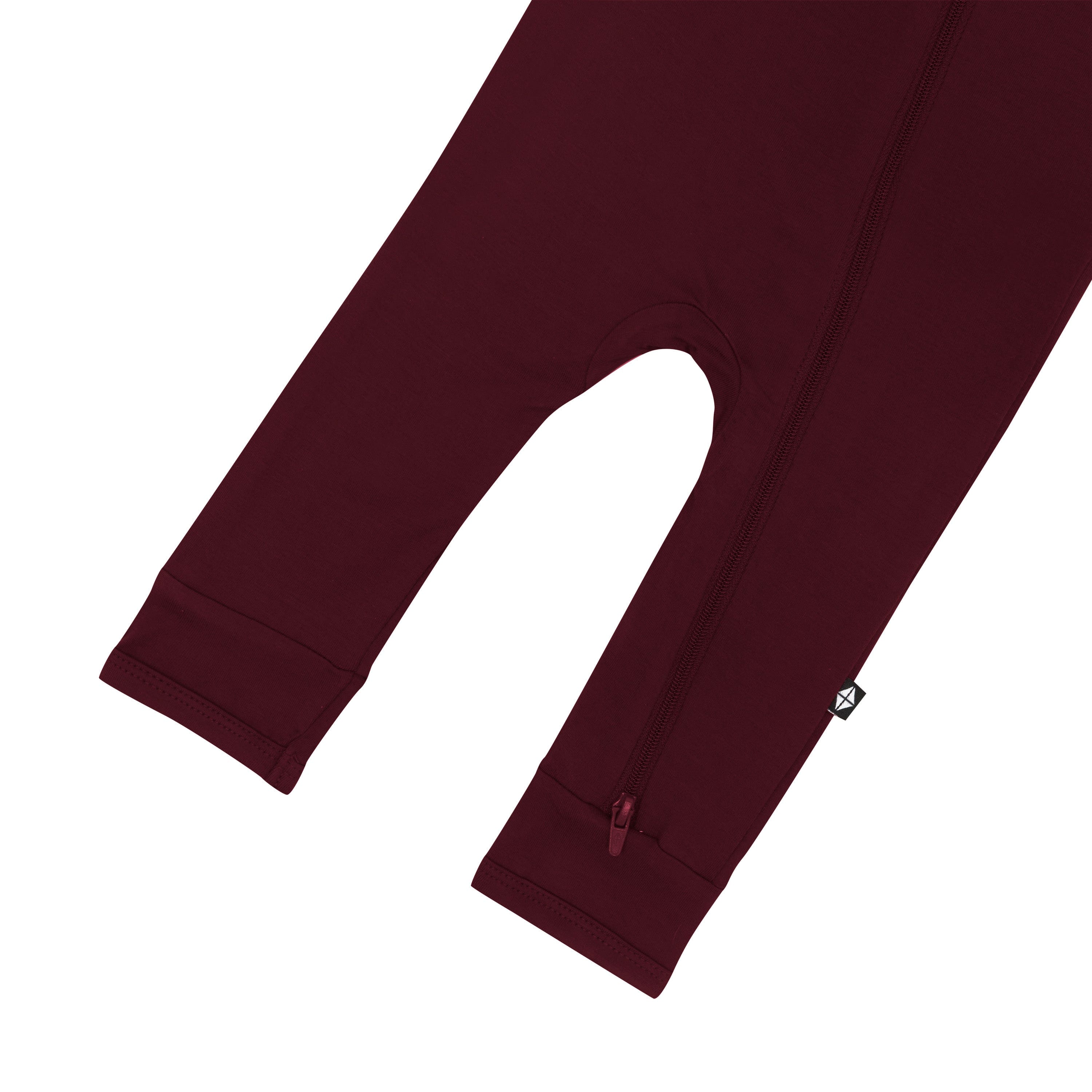 Bottom zipper shown on the leg of the Zippered Romper in Burgundy
