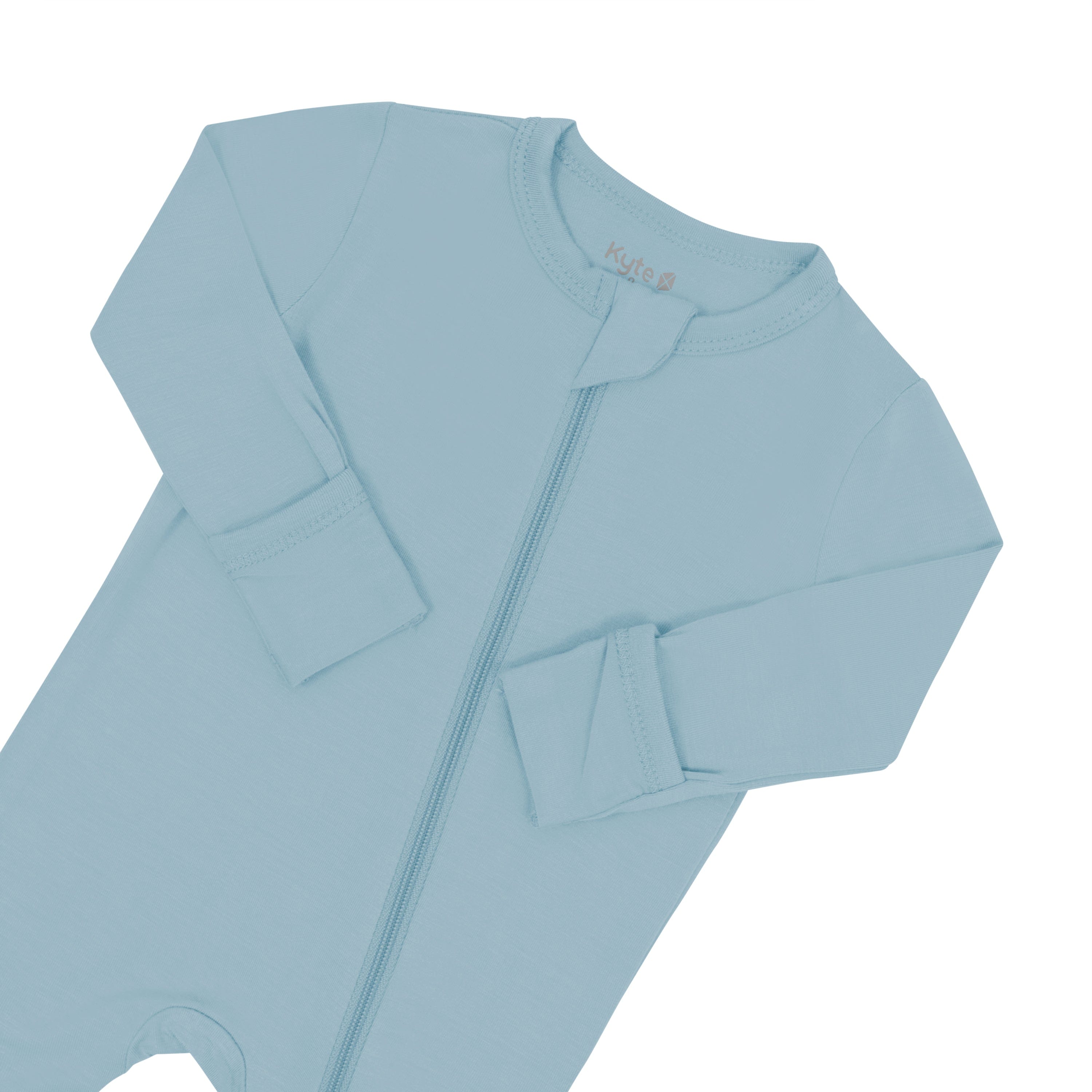 Zipper garage and fold over cuffs on Kyte Baby bamboo Zippered Romper in Dusty Blue