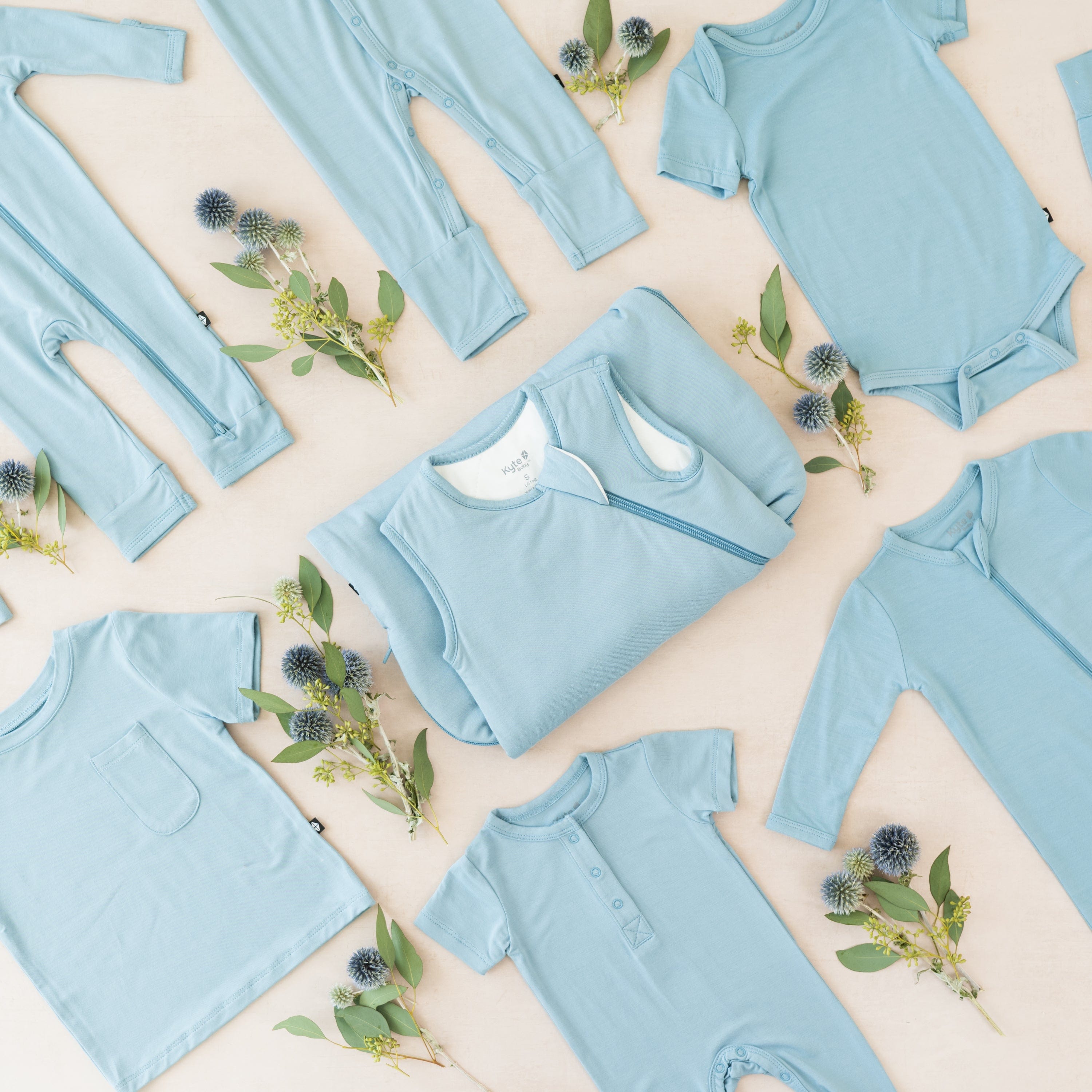 Kyte Baby selection of bamboo baby clothing and sleep bags in Dusty Blue