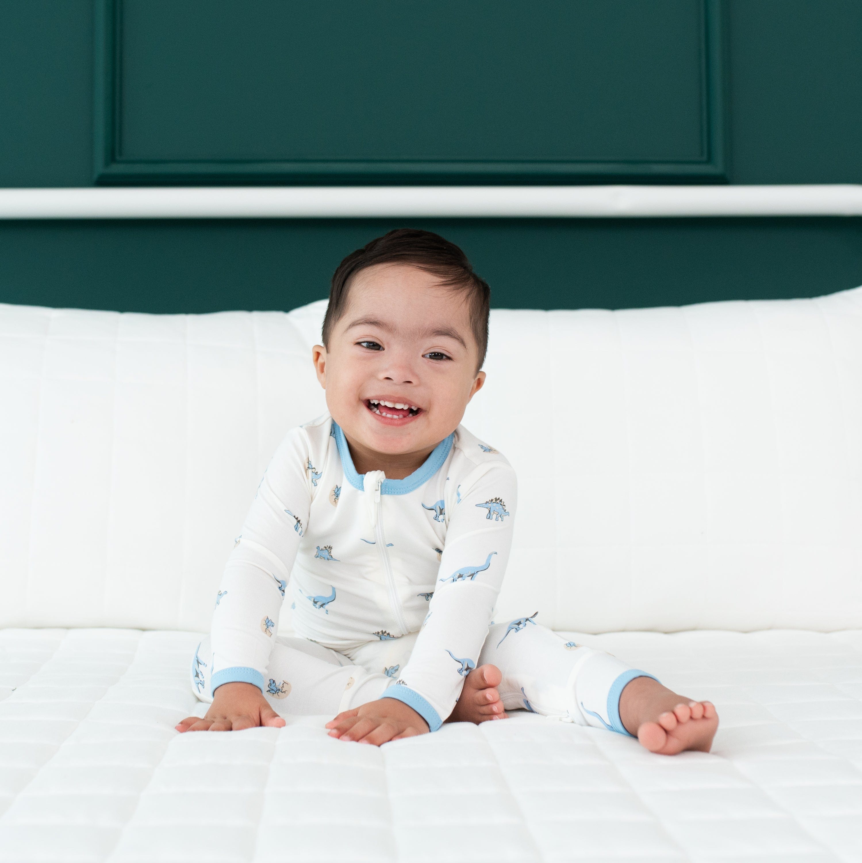 Toddler wearing Kyte Baby Zippered Romper in Jurassic