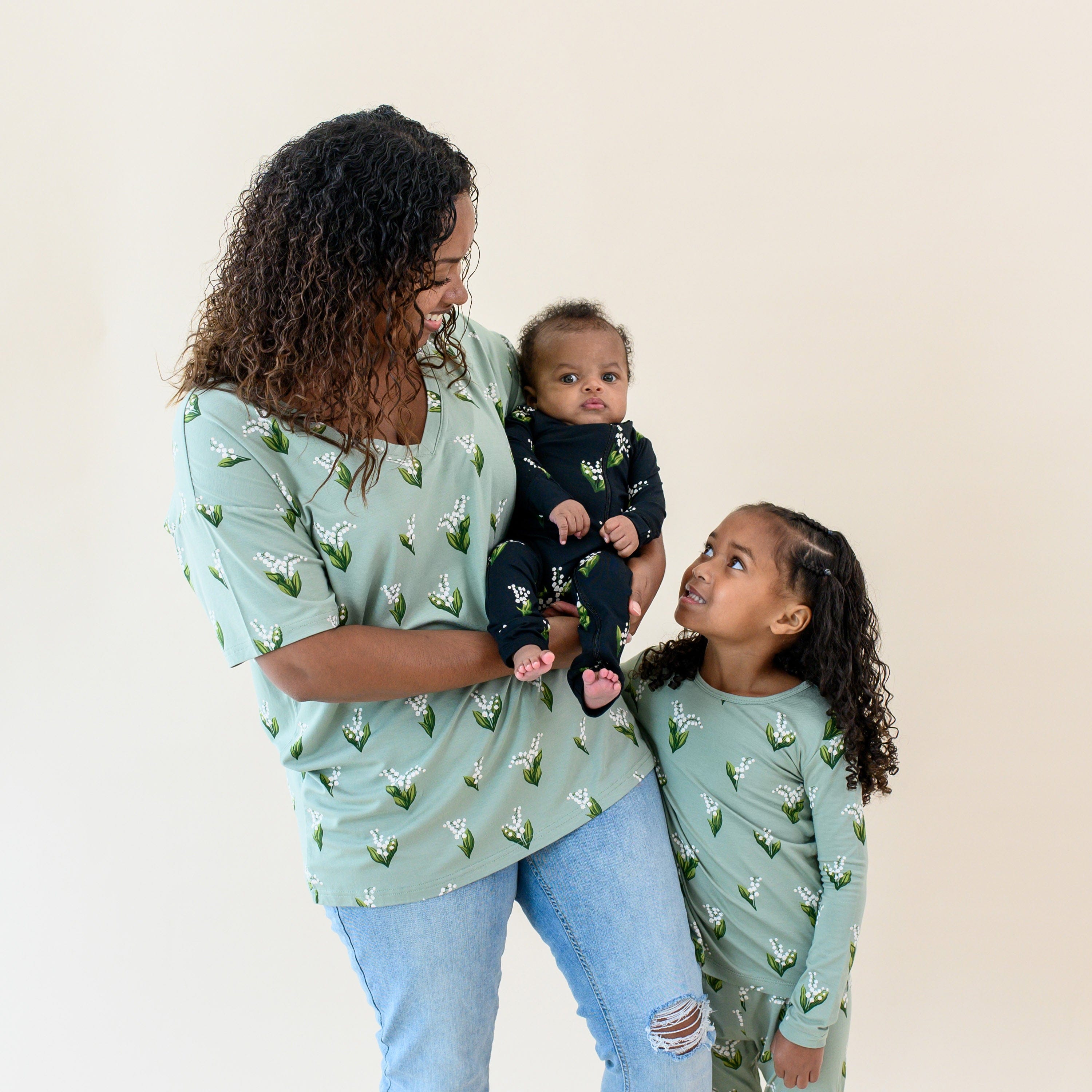 Mother wearing the Women's Relaxed Fit V-Neck in Thyme Lily with her two children in matching sets