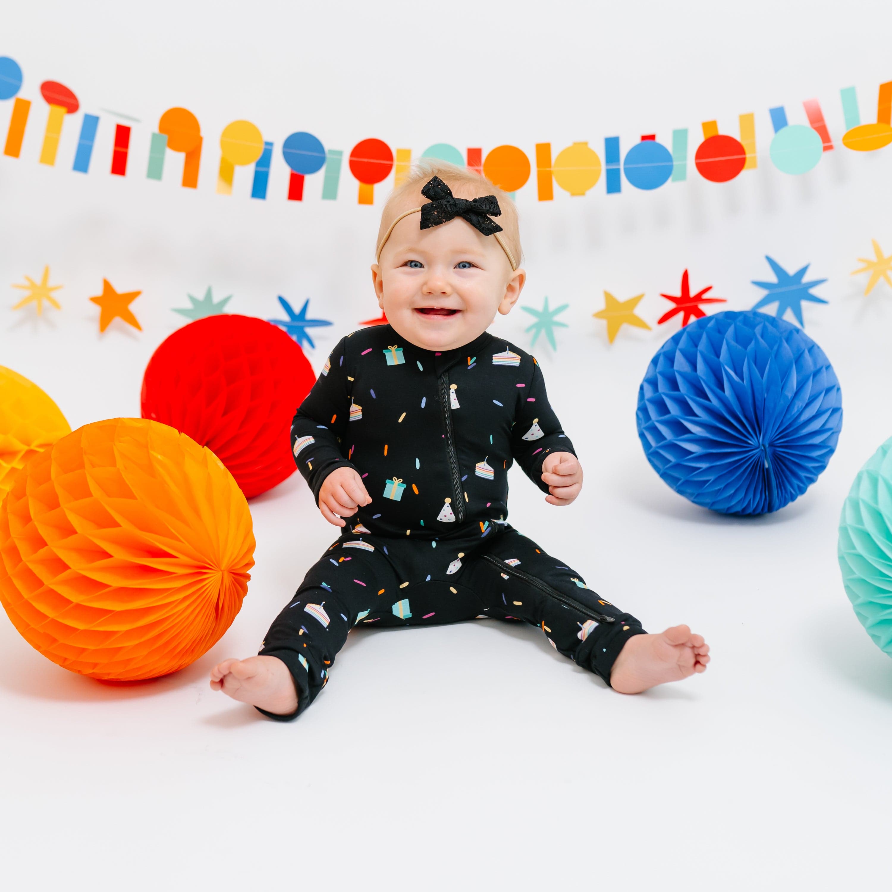 Kyte Baby Zippered Rompers Zippered Romper in Midnight Party