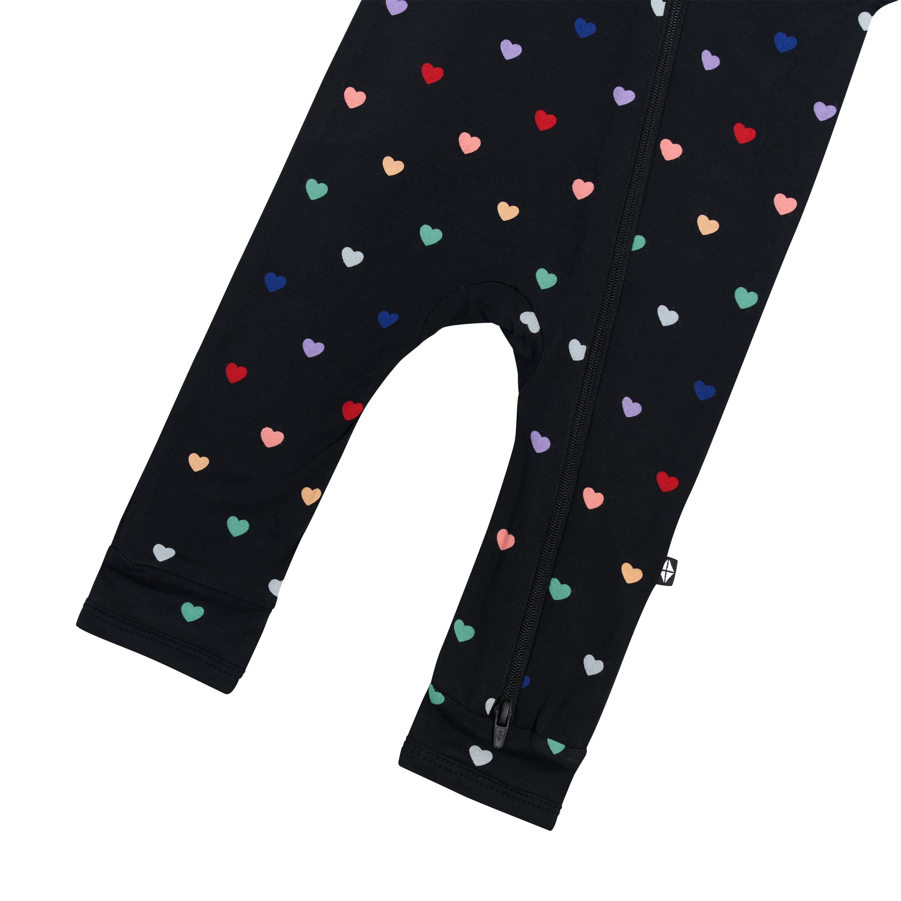 Open feet on Kyte Baby Zippered Romper pajamas in Midnight Rainbow Heart