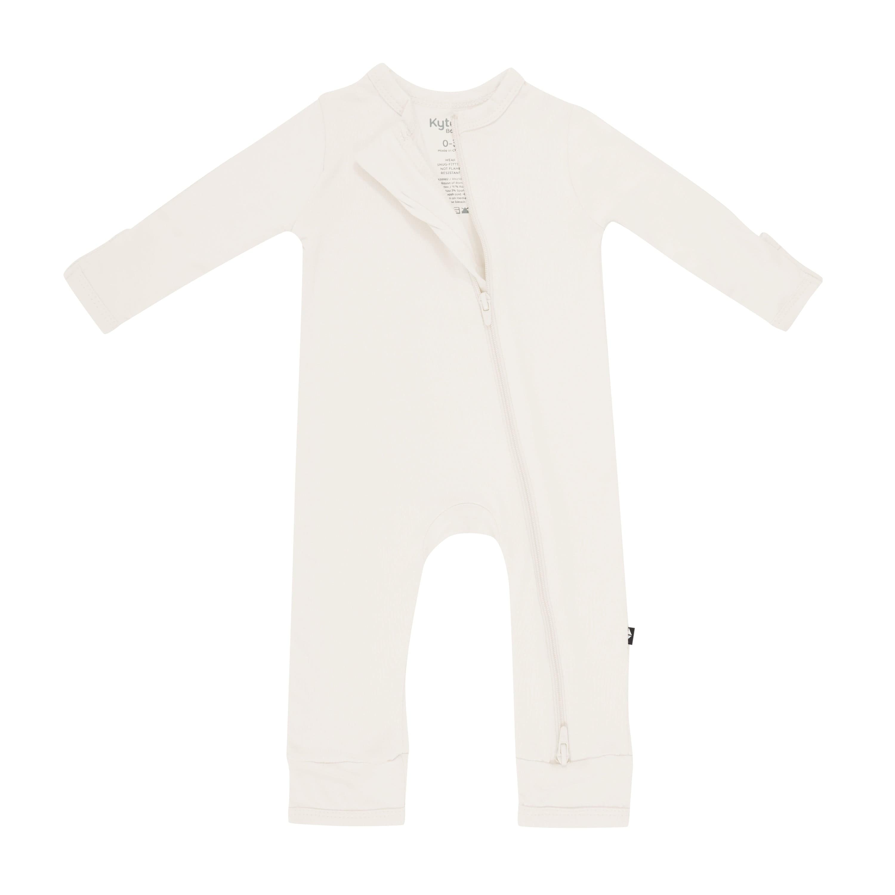 Kyte Baby Zippered Romper in Oat with double zipper partially unzipped from the top
