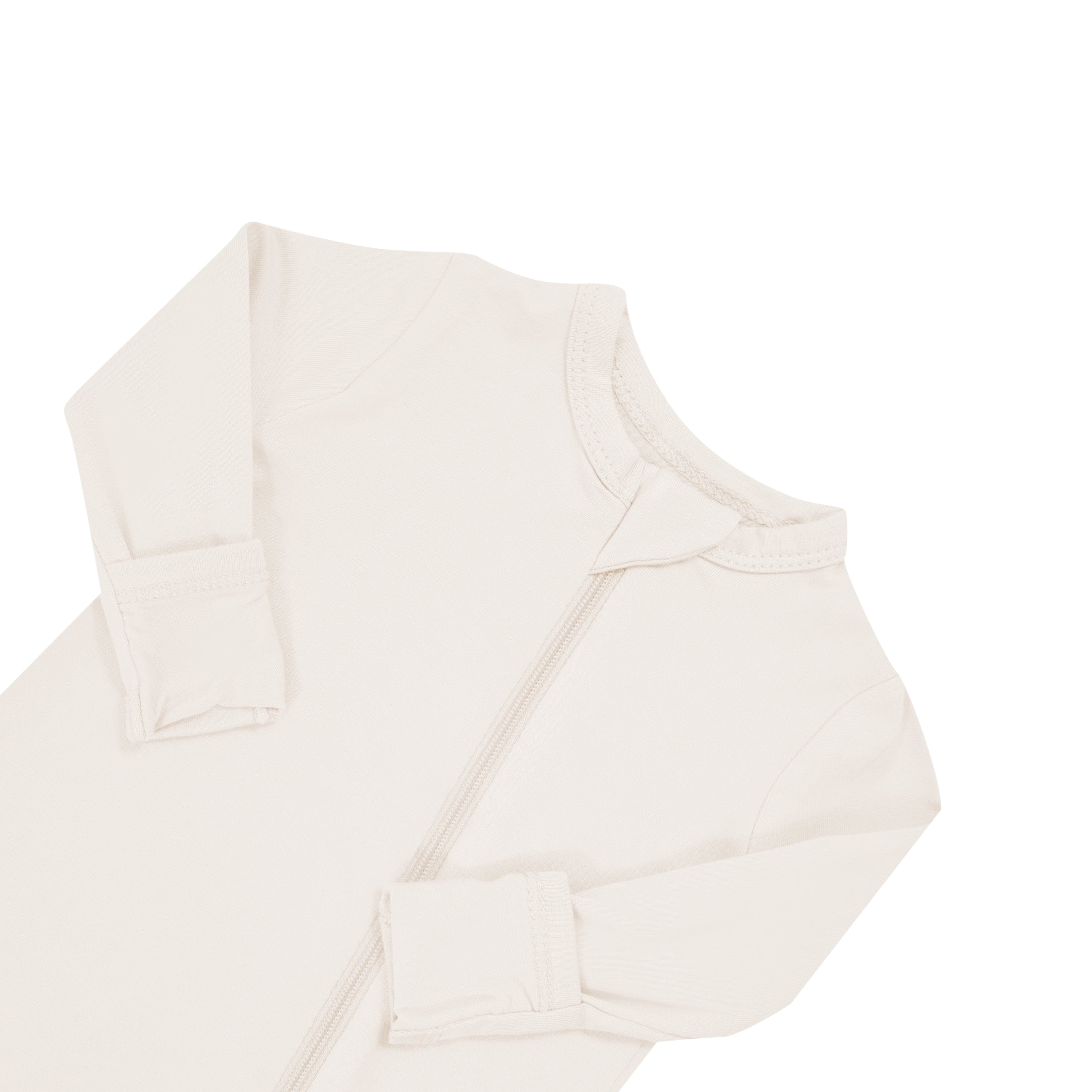 Close up of zipper garage on Kyte Baby Zippered Romper in Oat