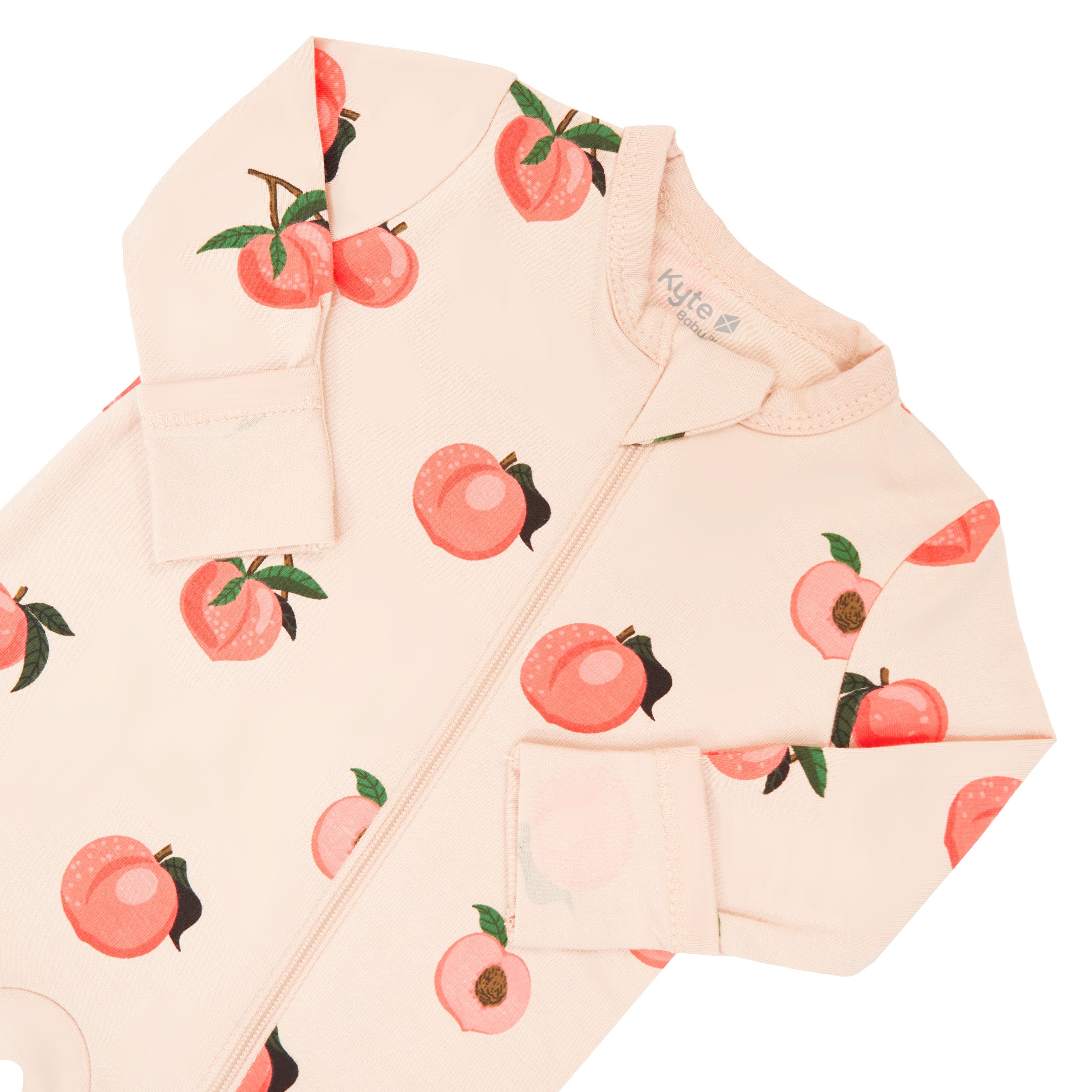 Zipper garage on Kyte Baby bamboo Zippered Romper in Peach