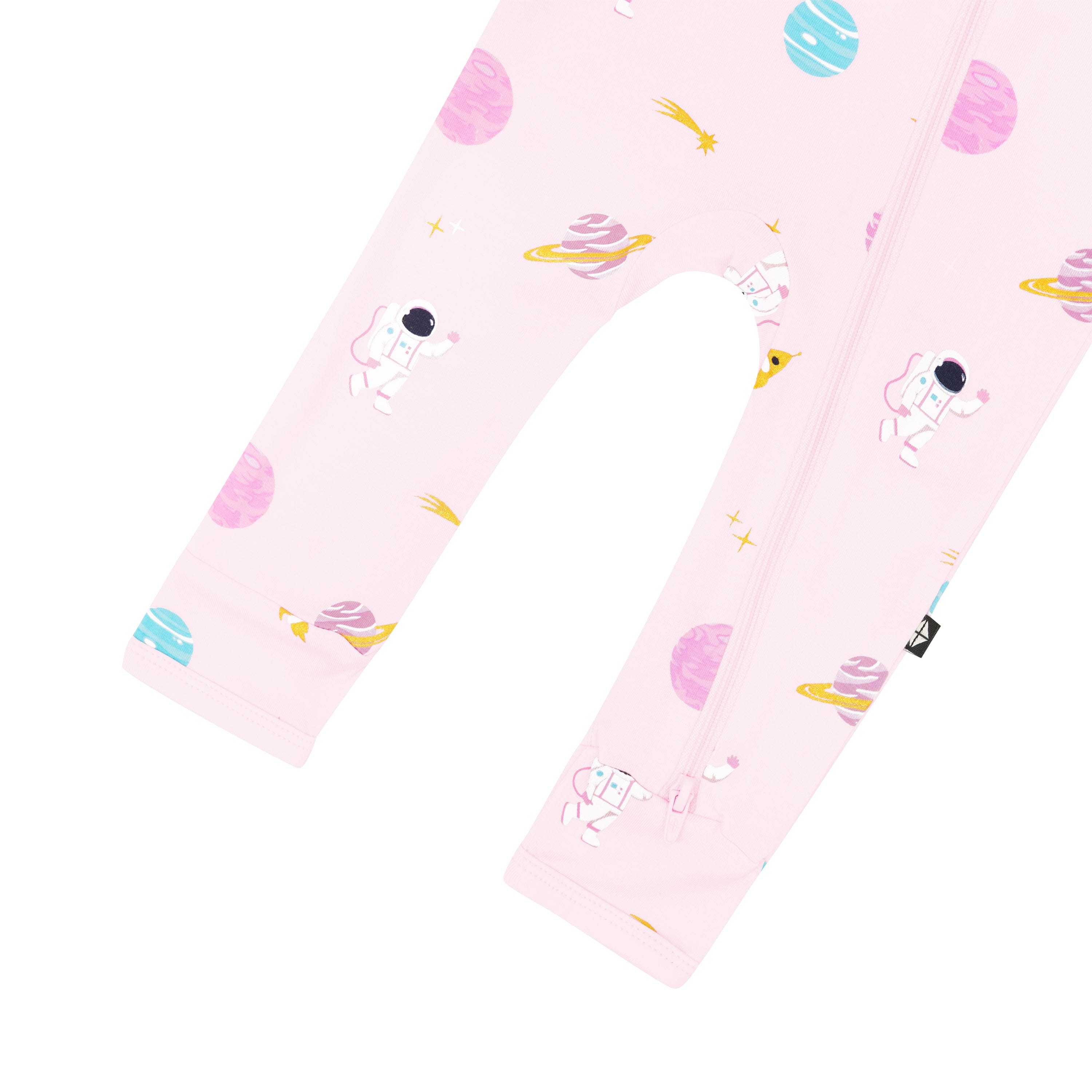 Dual zipper shown on the leg of the Zippered Romper in Sakura Space