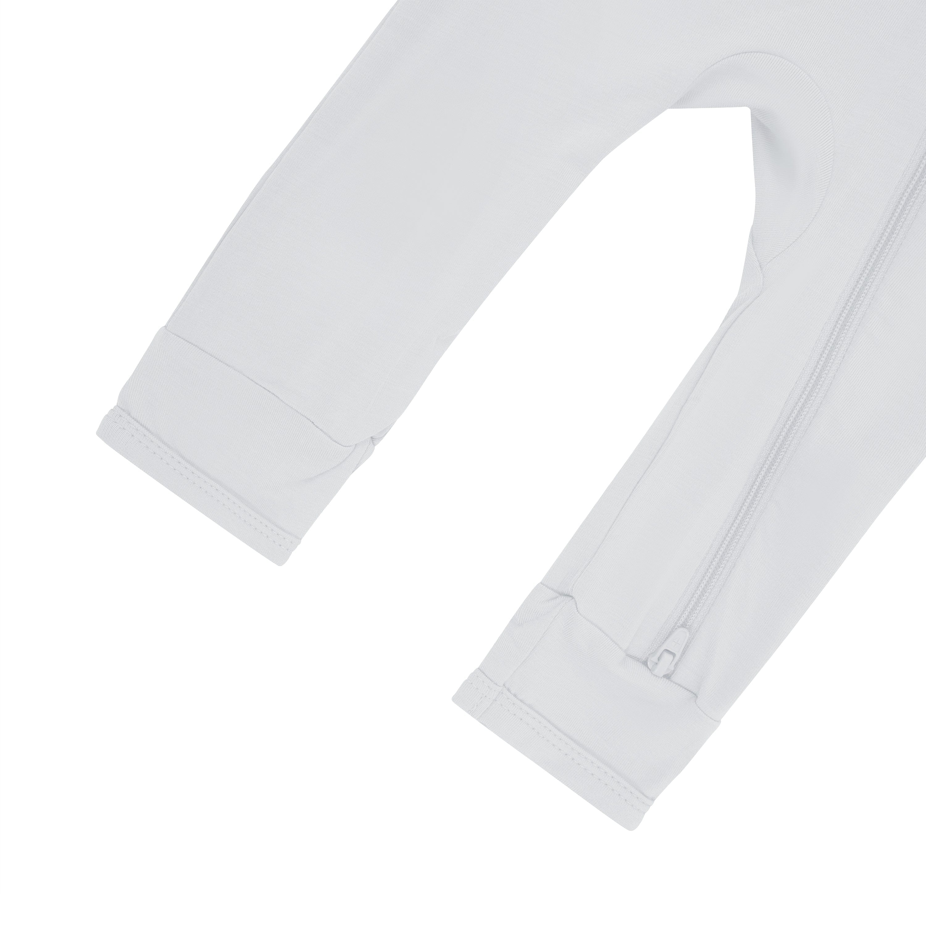 Close up of open feet and bottom zipper on Kyte Baby Zippered Romper in Storm