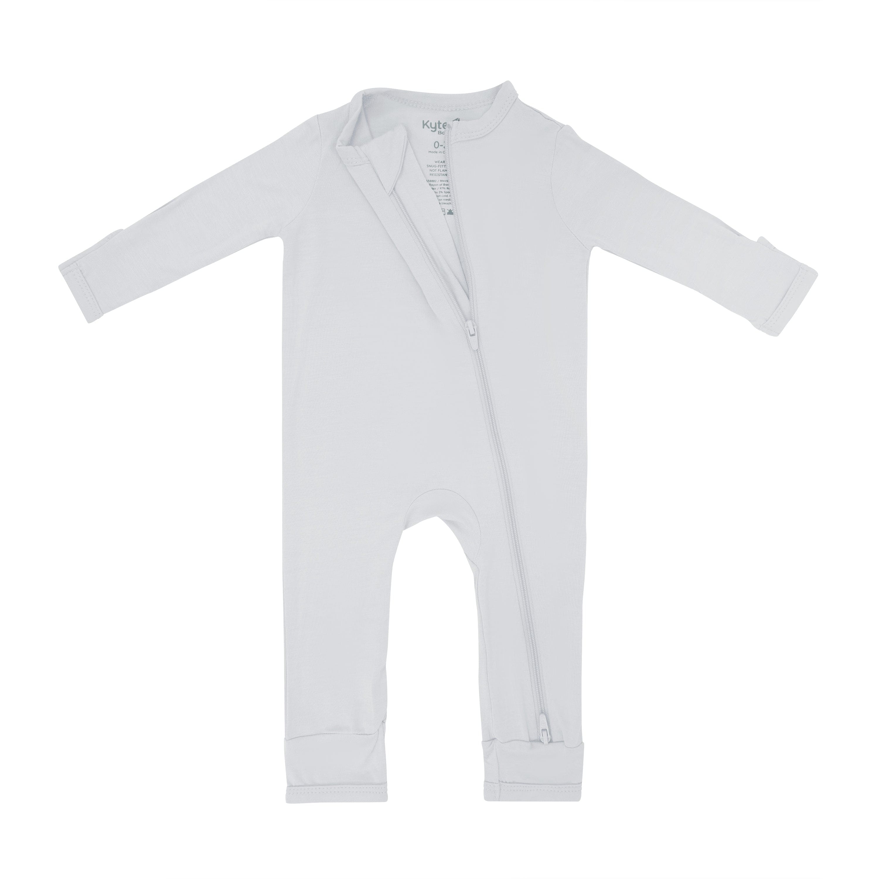 Dual zipper partially unzipped from the top on the Zippered Romper in Storm