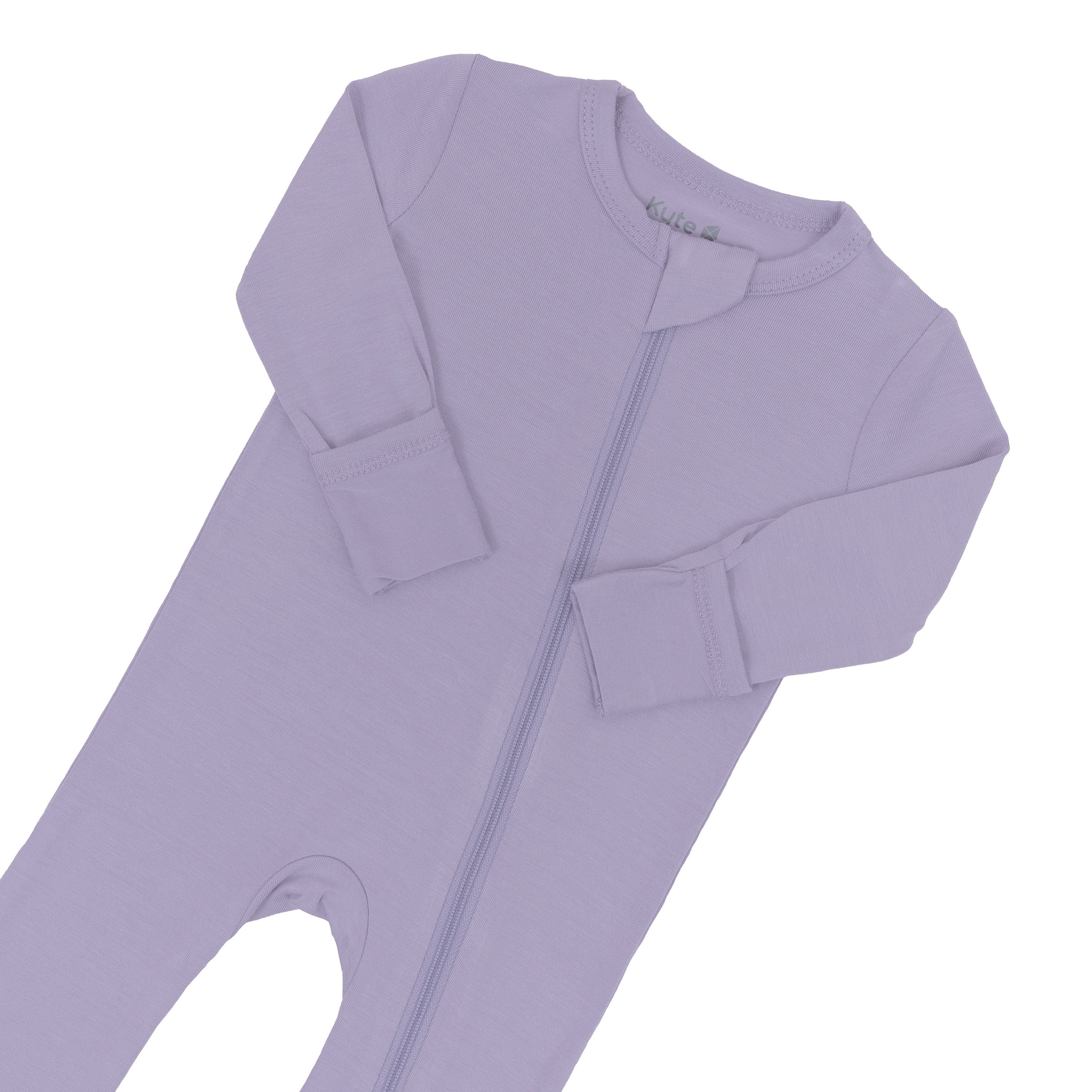 Close up of zipper garage and fold-over cuffs on zippered romper in Taro