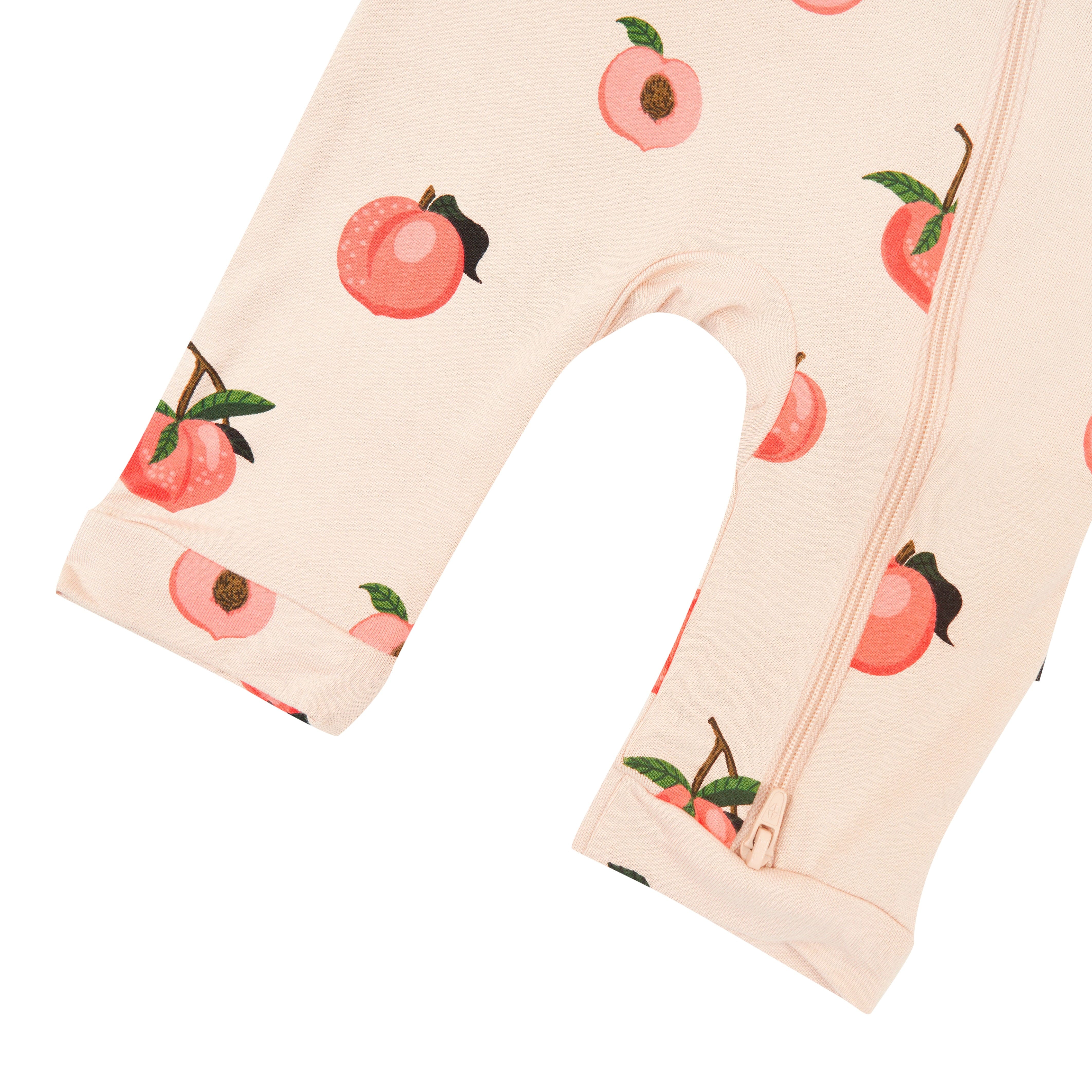 Capri length Kyte Baby Sleeveless Zippered Romper in Peach