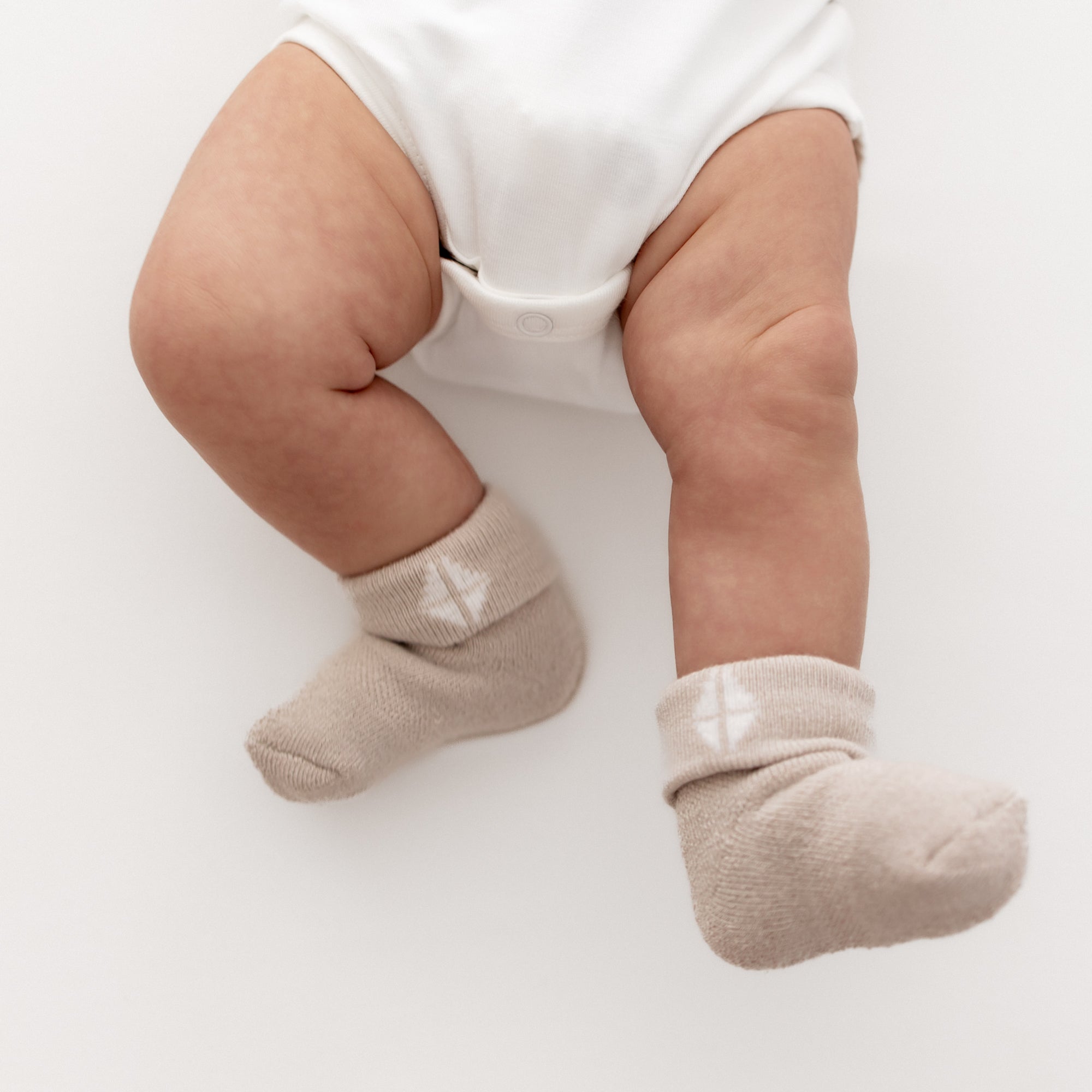 Baby wearing Oat tan infant socks