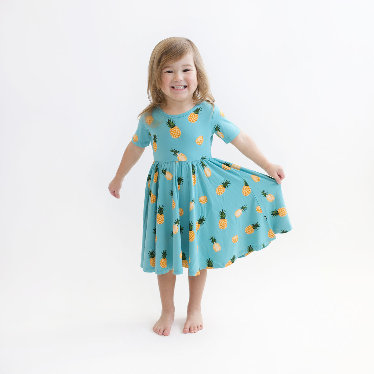 Toddler wearing Twirl Dress in Pineapple