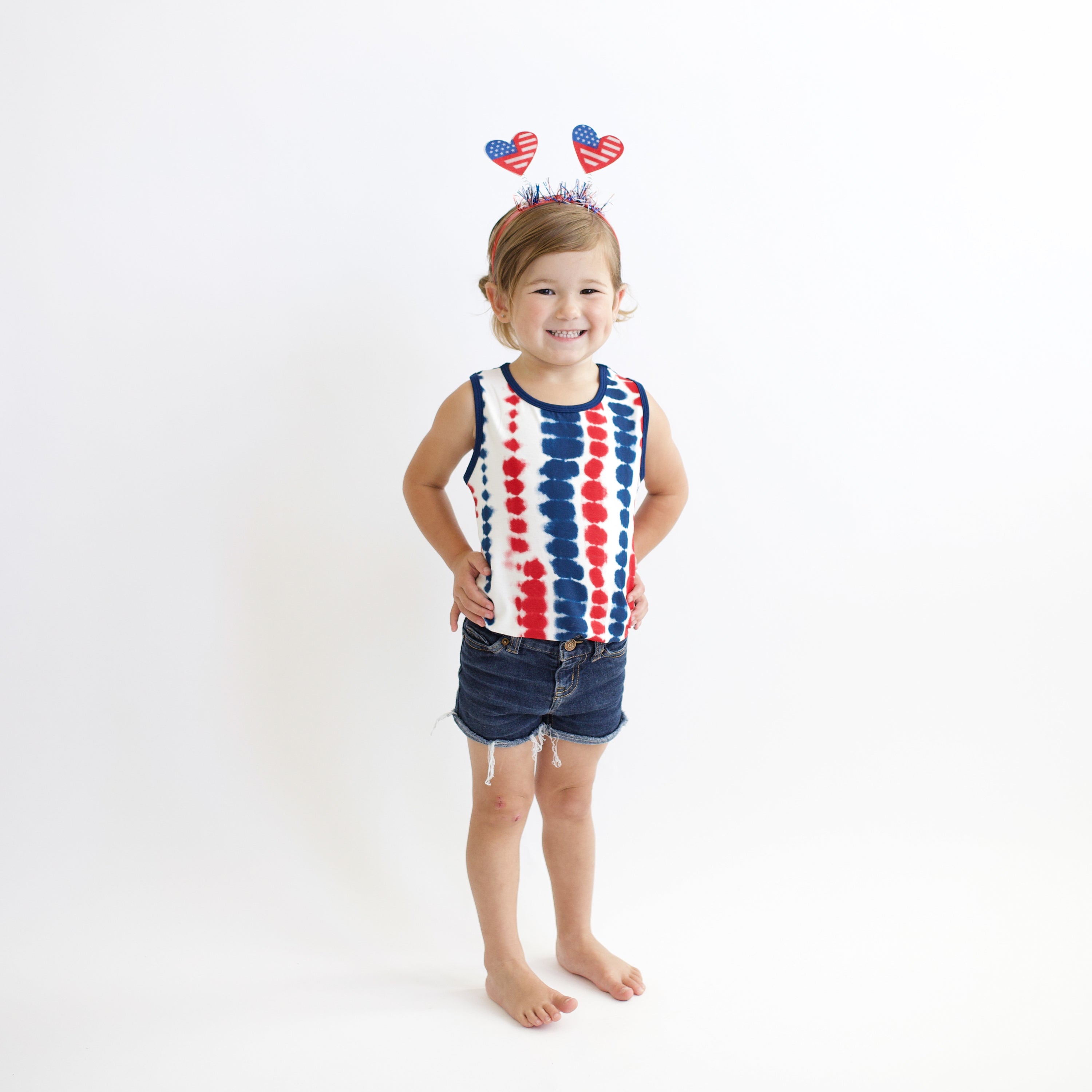 Toddler wearing Toddler Tank Top in Liberty Rip Tide and jean shorts