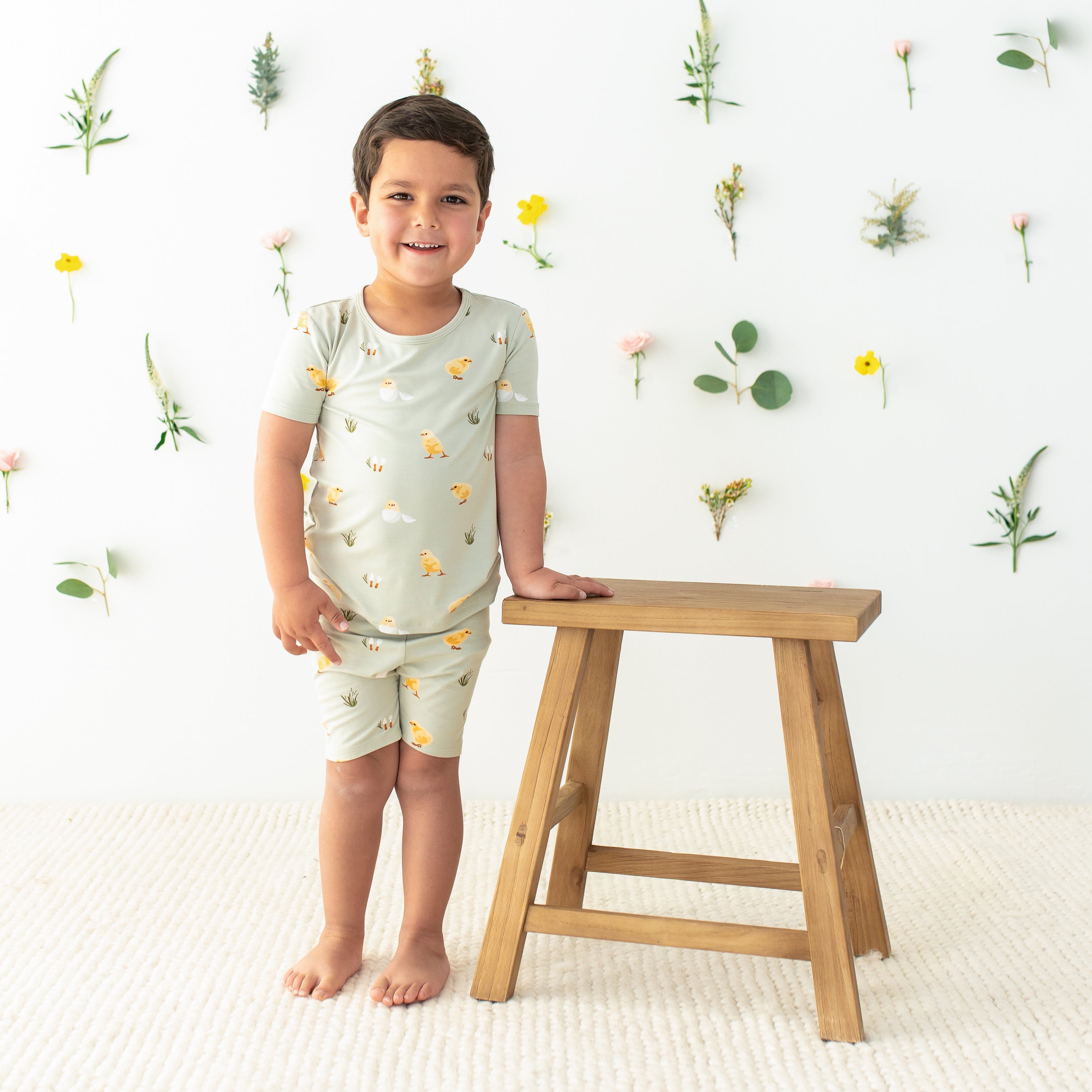 Toddler wearing Short Sleeve Pajamas in Aloe Chick