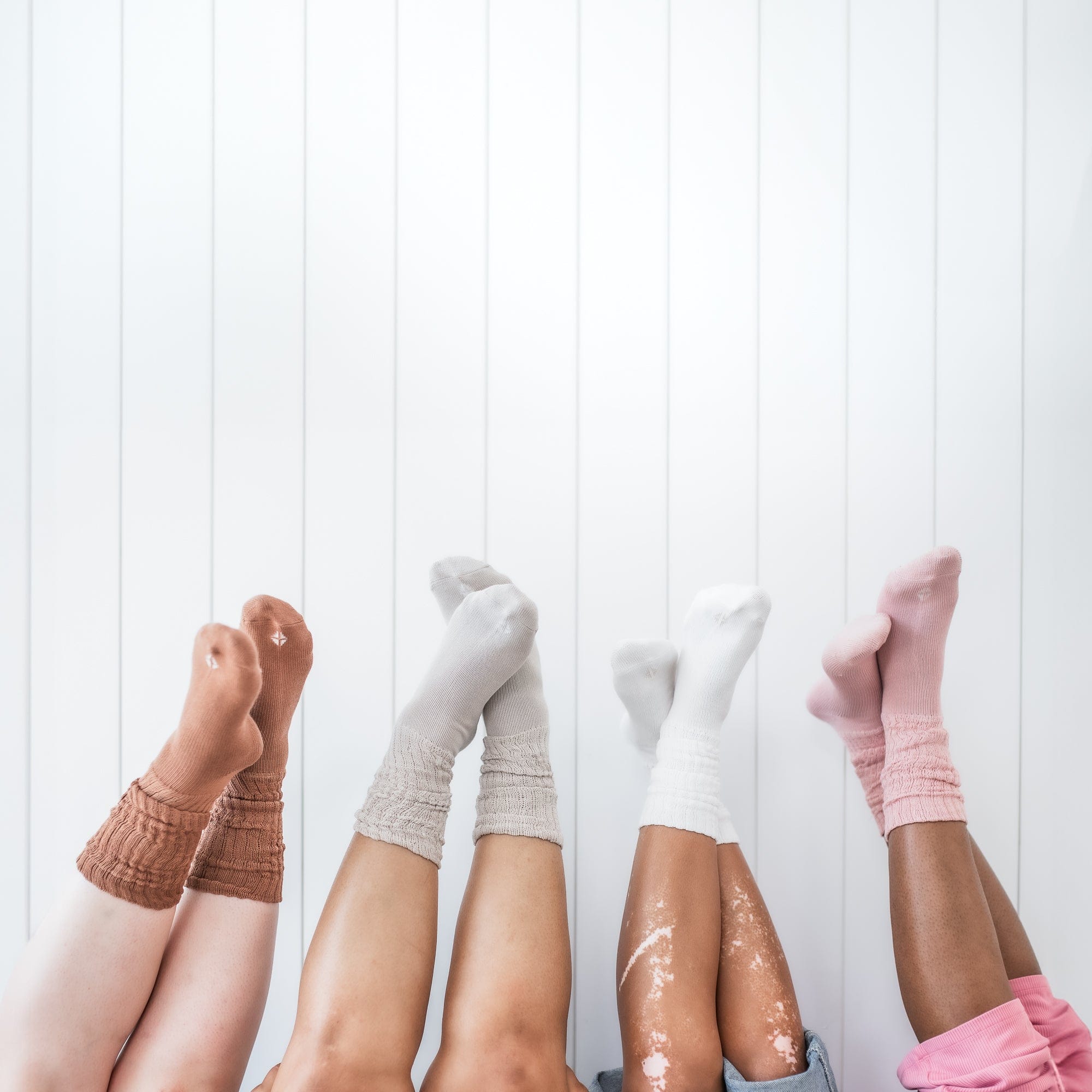 Adult Scrunch Socks in Blush, Cloud, Oat and Latte being worn by models