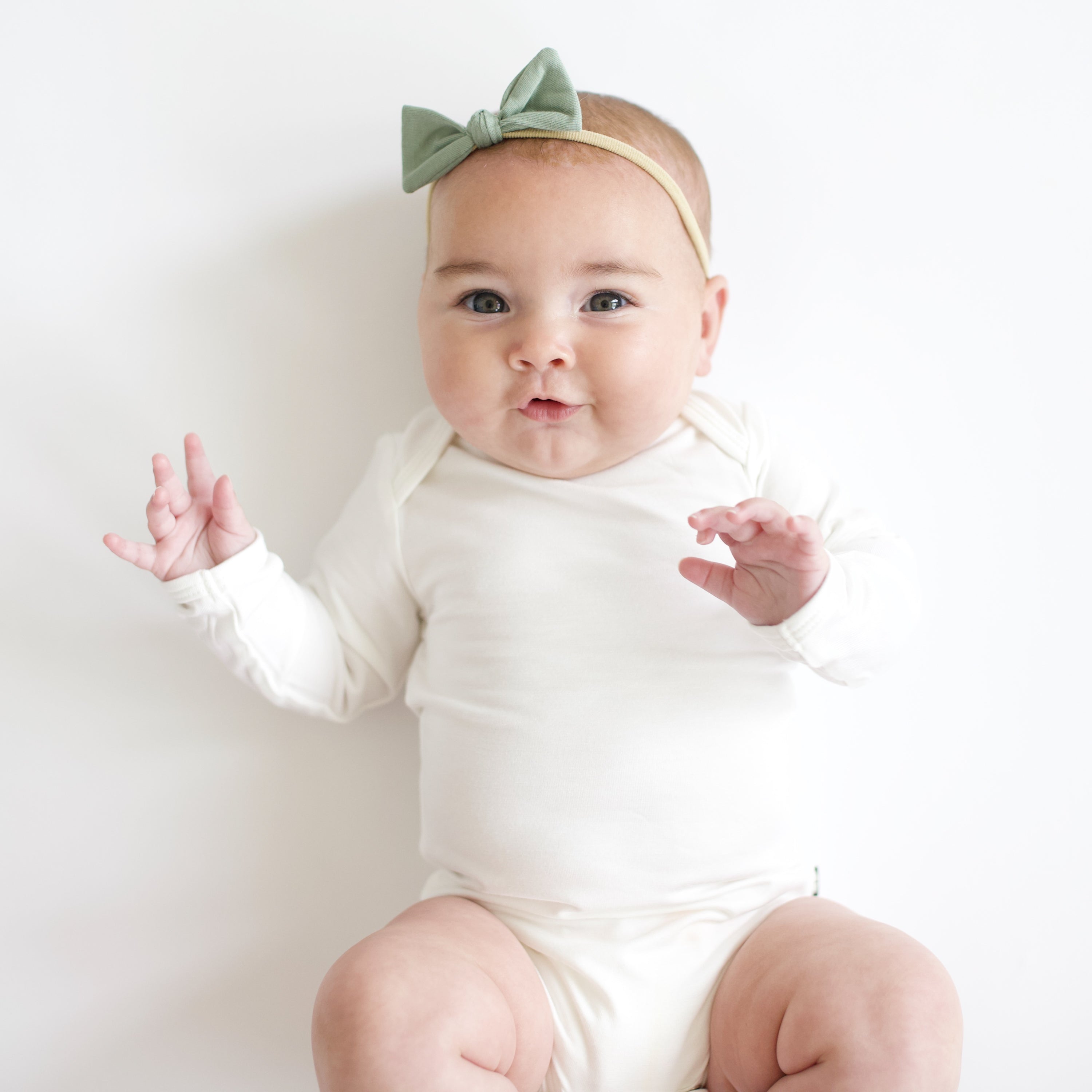 Baby wearing Tiny Nylon Bow in Thyme