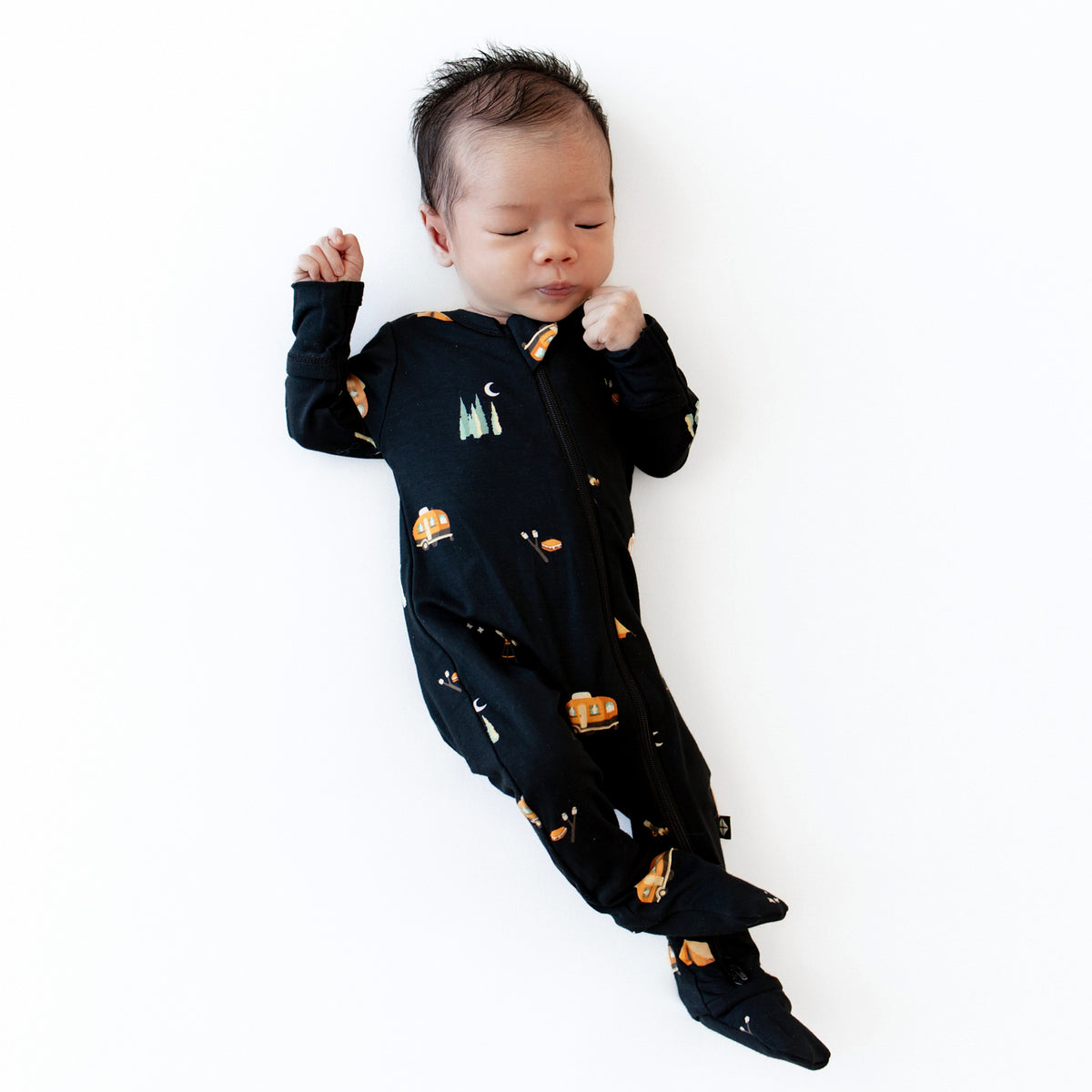 Newborn wearing the Zippered Footie in Under the Stars