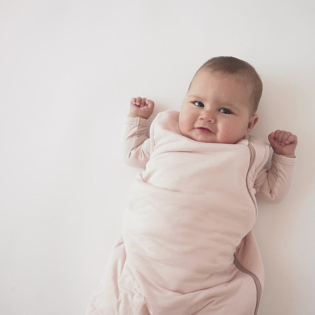 Video of baby wearing Kyte Baby Sleep Bag in Blush 2.5