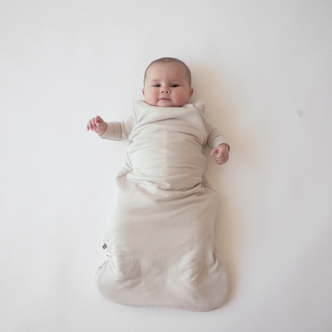 Video of baby wearing Kyte Baby Sleep Bag in Oat 1.0