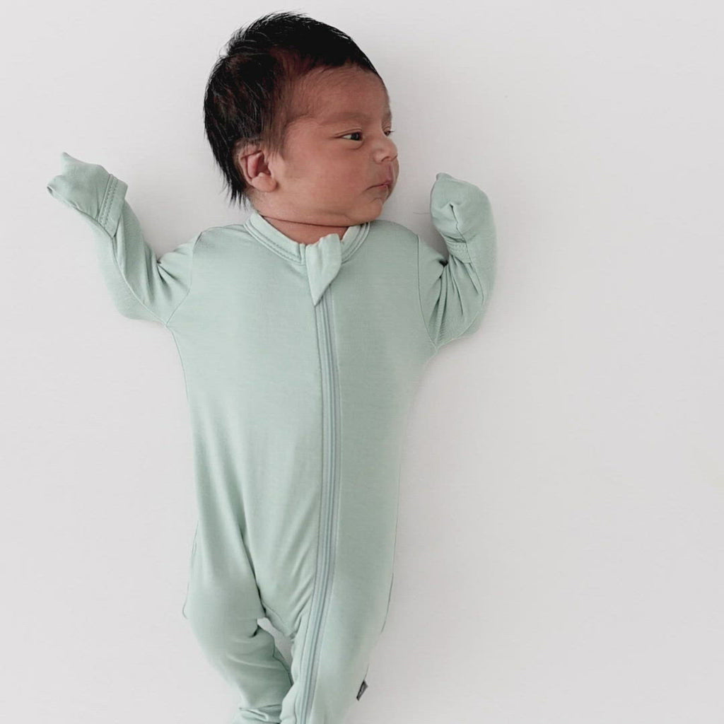 Video of baby wearing Kyte Baby Zippered Footie in Sage