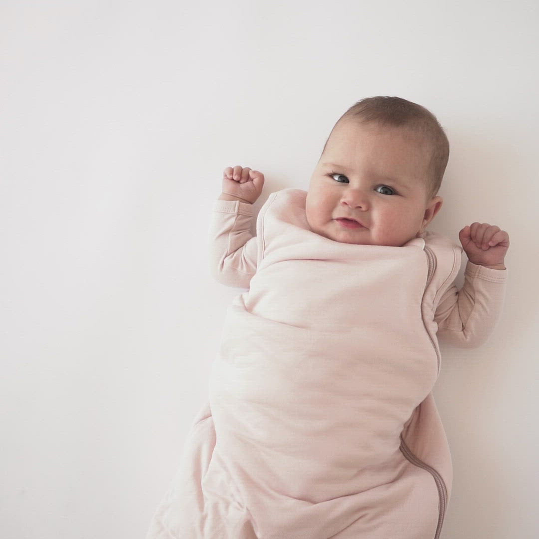 Video of baby wearing Kyte Baby Sleep Bag in Blush 1.0
