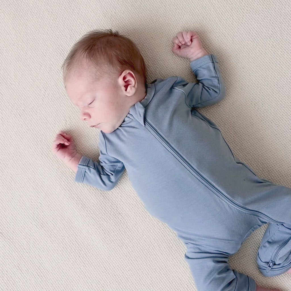 Video of infant wearing Kyte Baby Zippered Romper in Slate