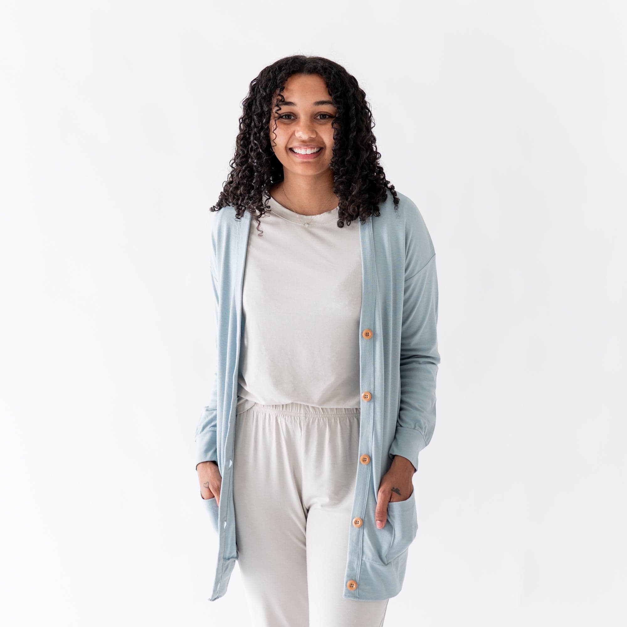 Woman wearing Kyte Baby Adult Cardigan in Fog