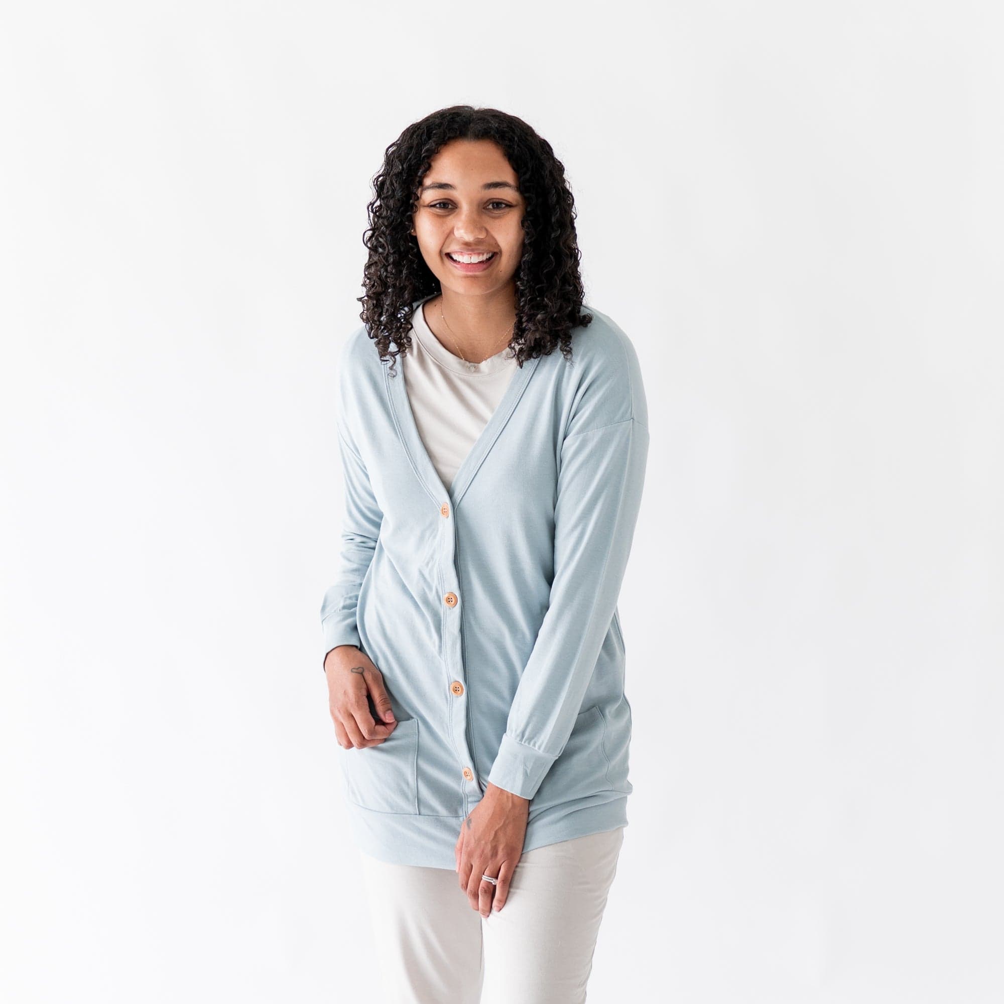 Woman wearing Kyte Baby Bamboo Jersey Long Adult Cardigan in Fog