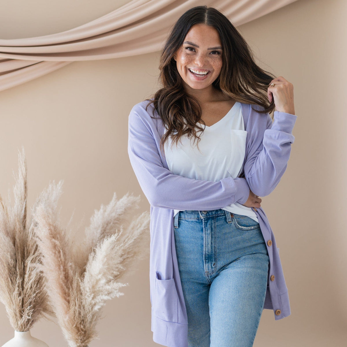 Woman wearing Kyte Baby Adult Cardigan in Taro