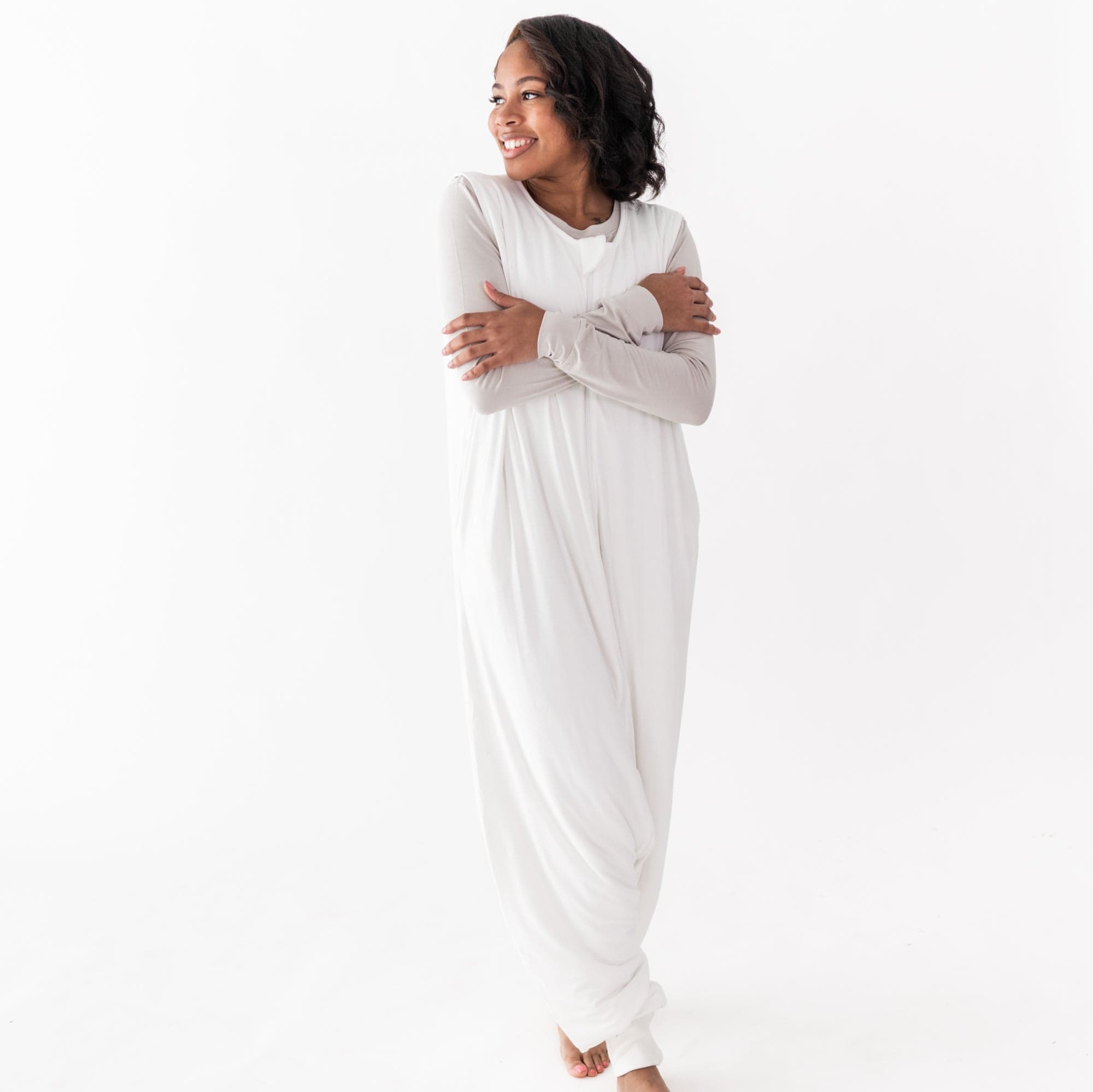 Woman wearing Kyte Baby Adult Sleep Bag Walker in Cloud