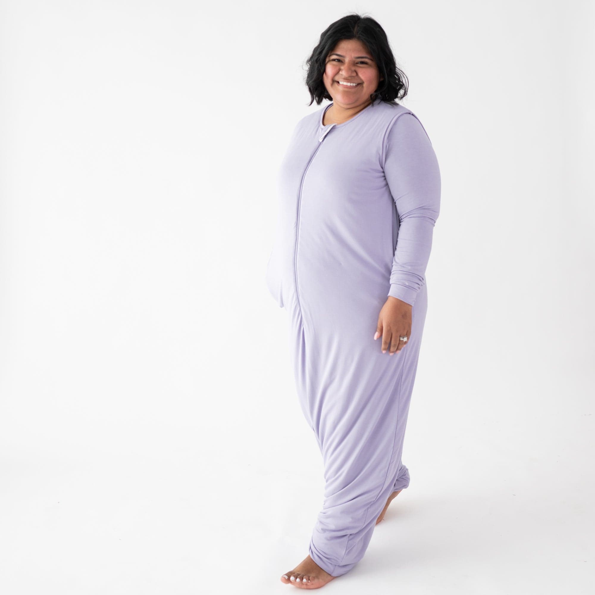 Woman wearing Kyte Baby Adult Sleep Bag Walker in Taro purple