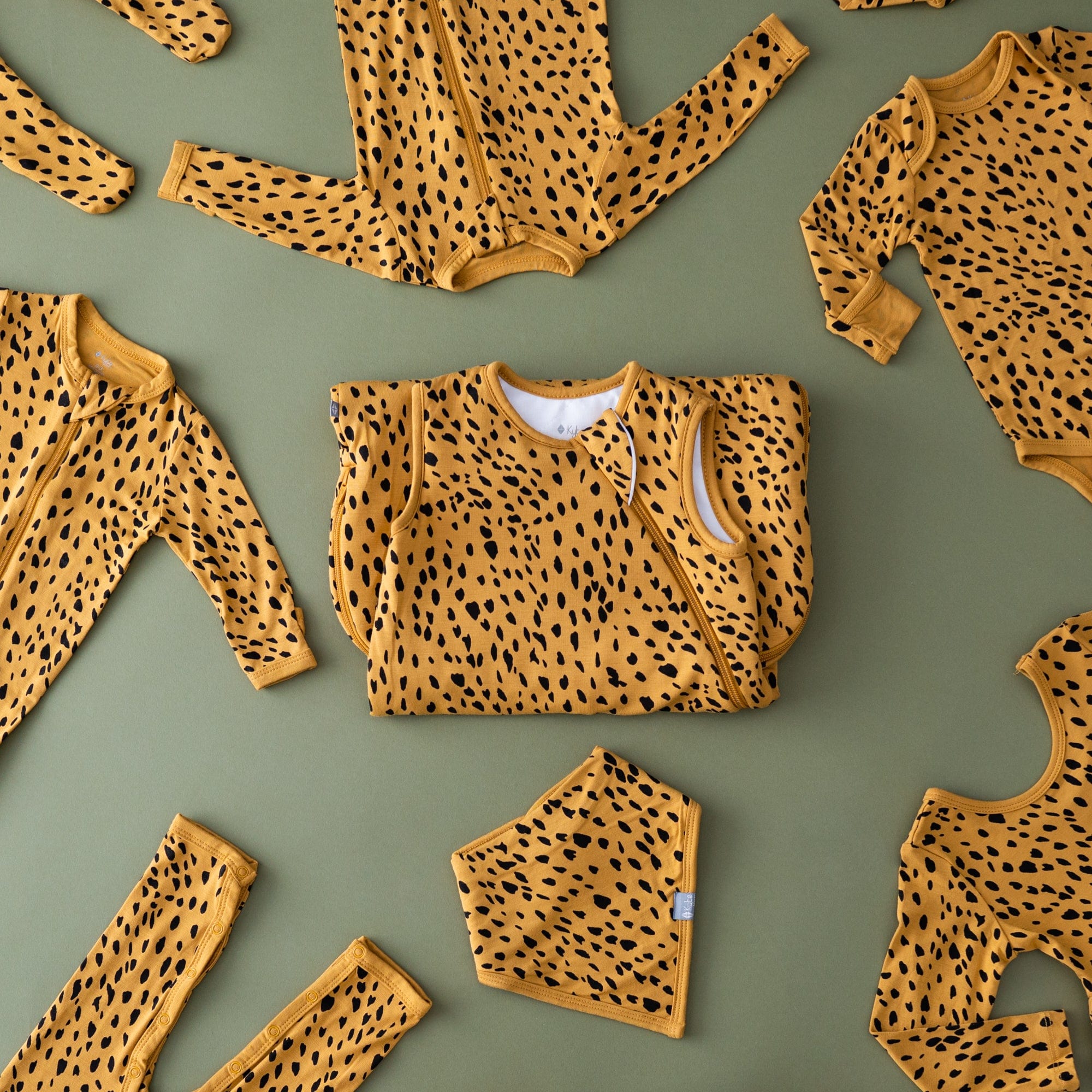 Kyte BABY Bib Marigold Cheetah Bib in Marigold Cheetah