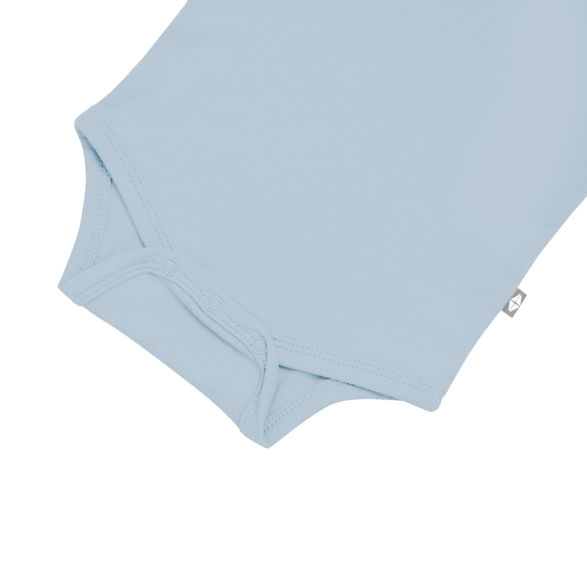 Snap bottom of Kyte Baby Long Sleeve Bodysuit in Fog