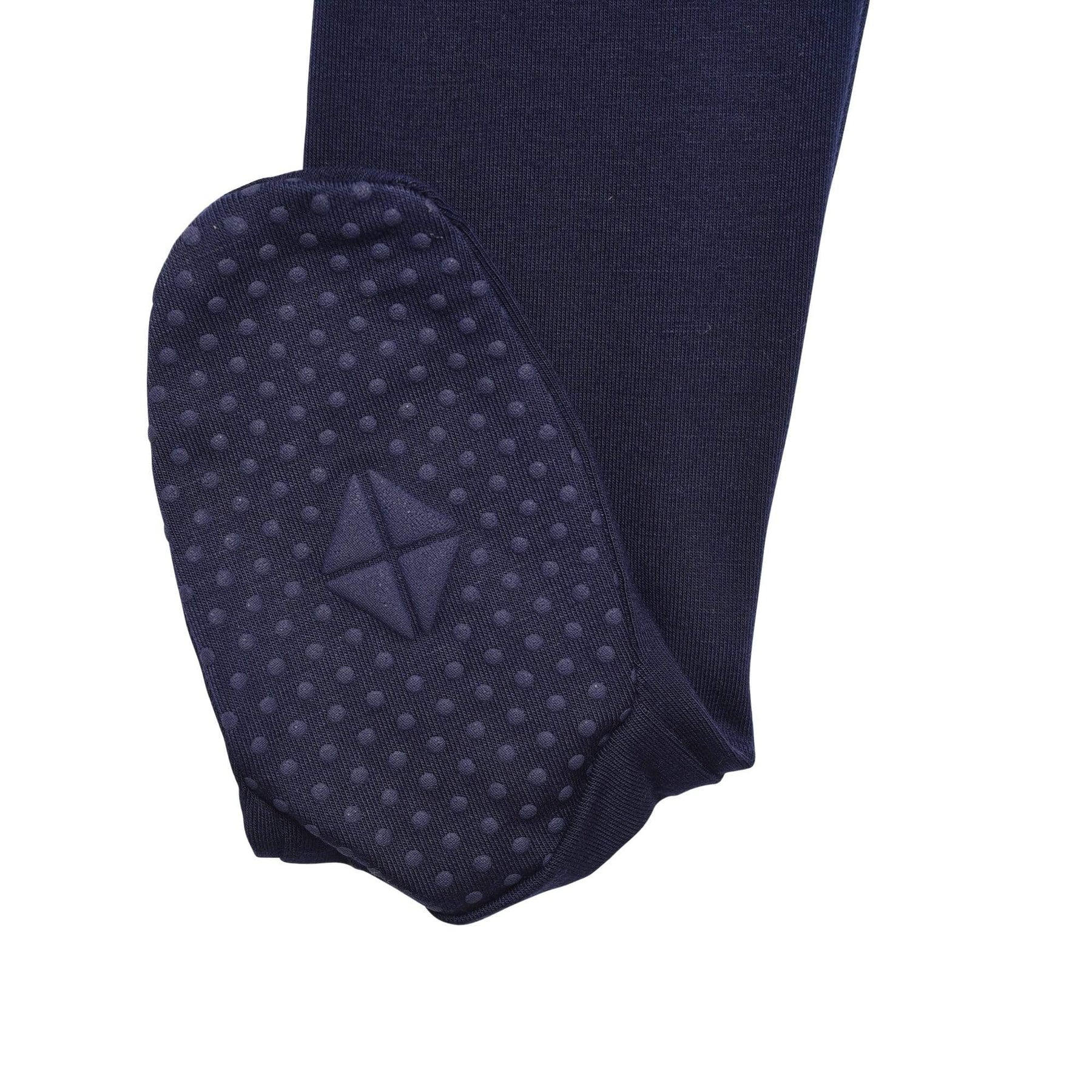 Sole grips on Kyte Baby Zippered Footie in Navy