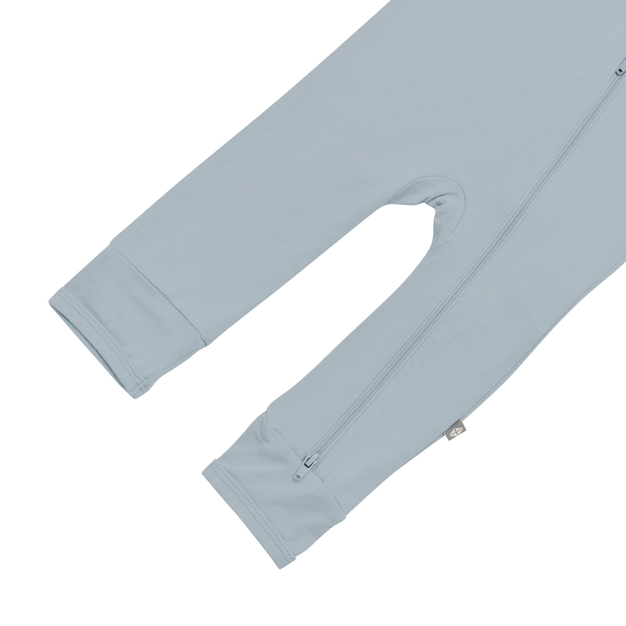 Open feet on Kyte Baby Zippered Romper in Fog