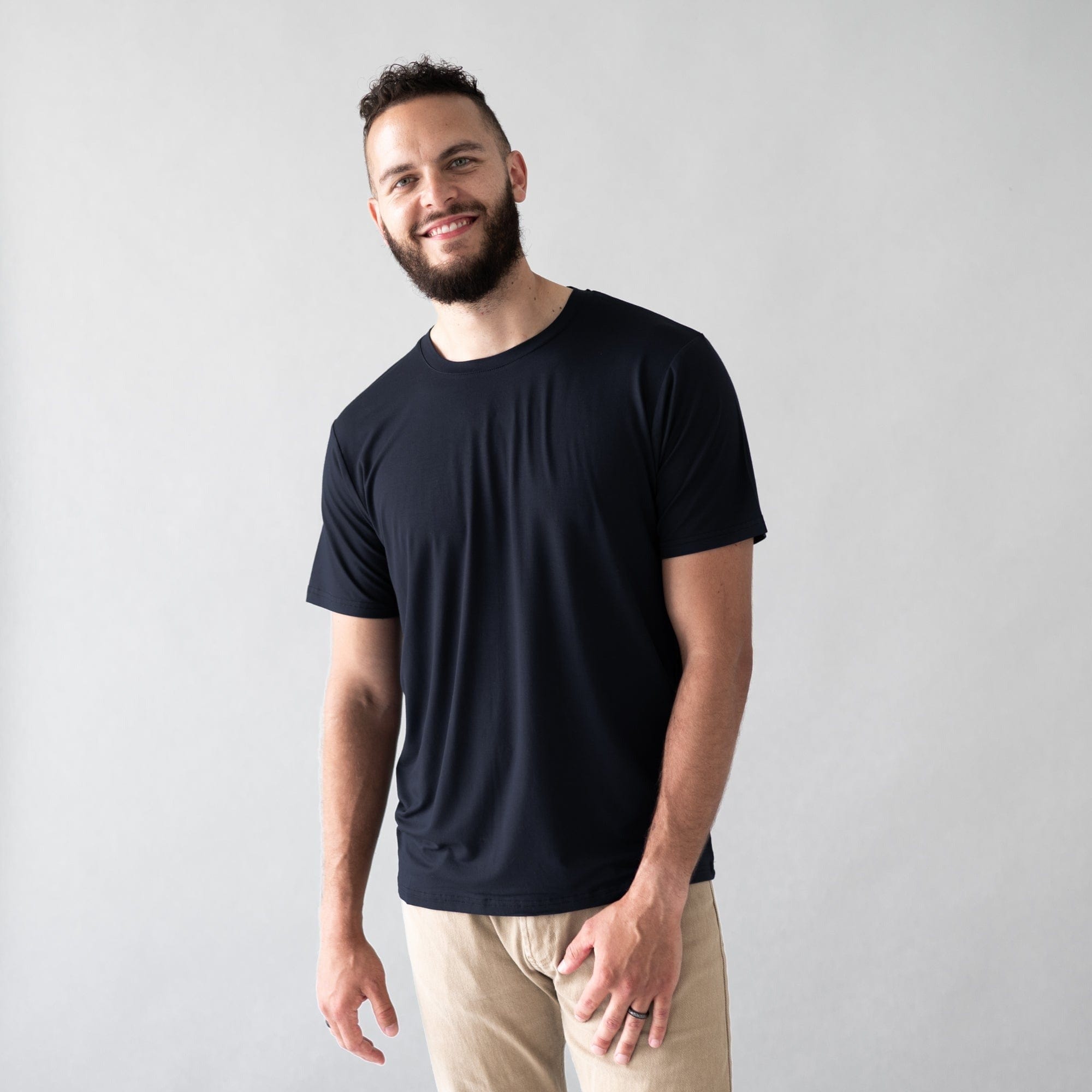 Man wearing Kyte Baby Bamboo Crew Neck Tee in Midnight black