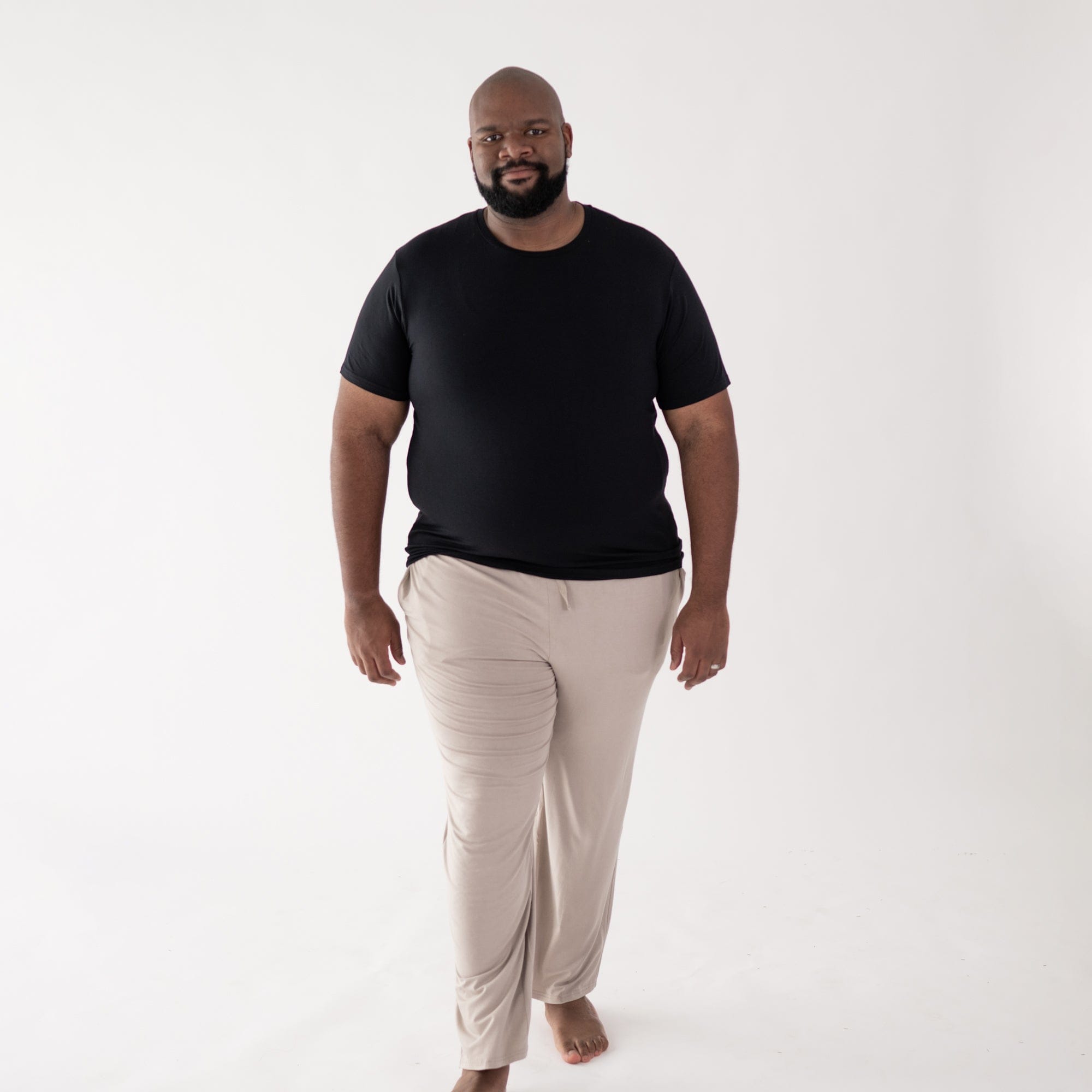 Man wearing Kyte Baby Men's Crew Neck Tee in Midnight