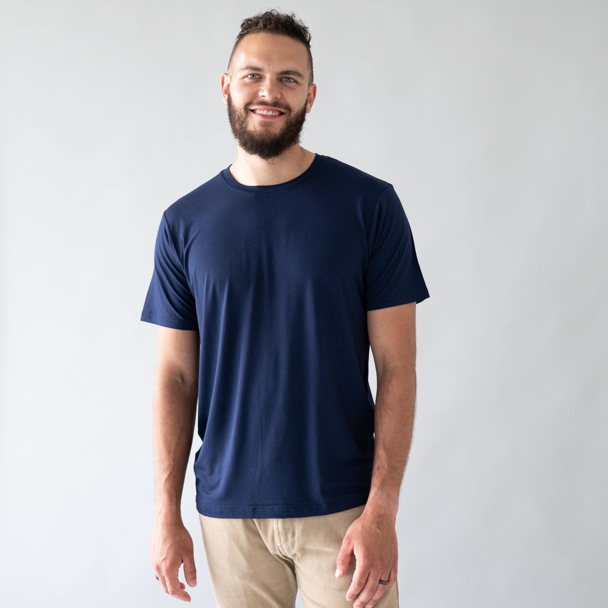 Man wearing Kyte Baby Bamboo Crew Neck Tee in Navy
