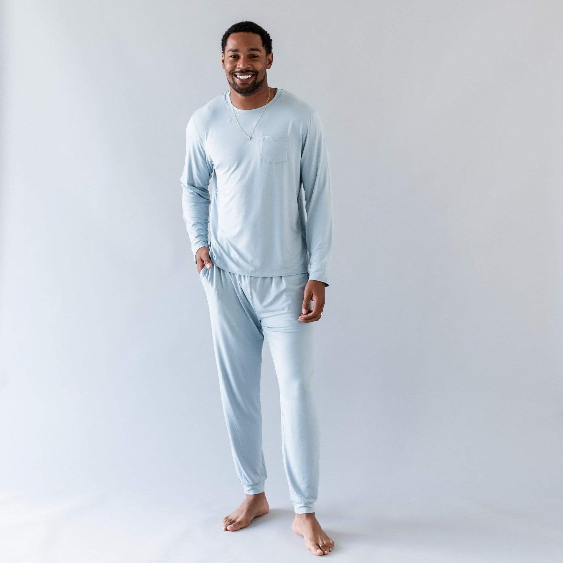 Man wearing Kyte Baby bamboo men's jogger set in Fog