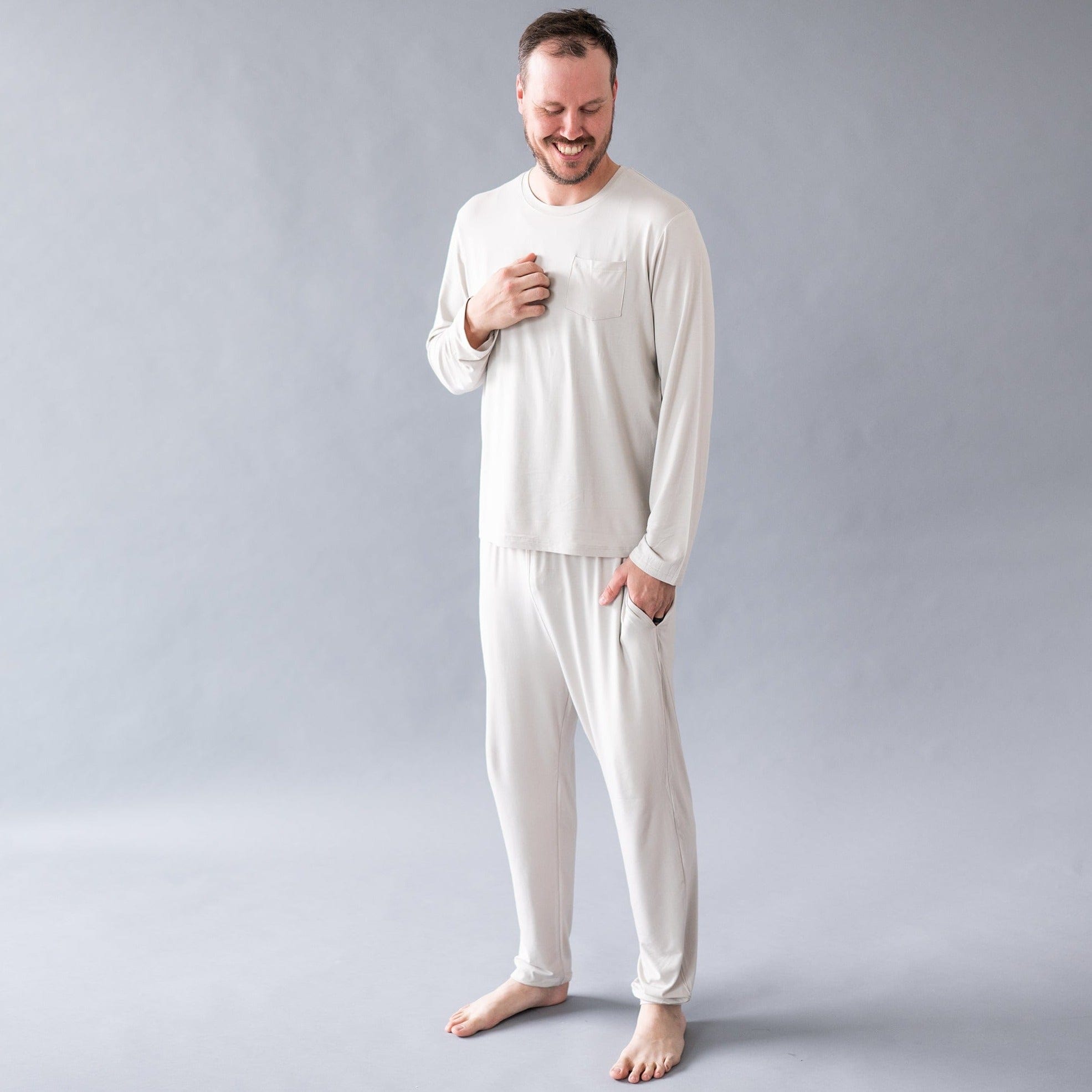 Man wearing Kyte Baby bamboo jogger set for men in Oat
