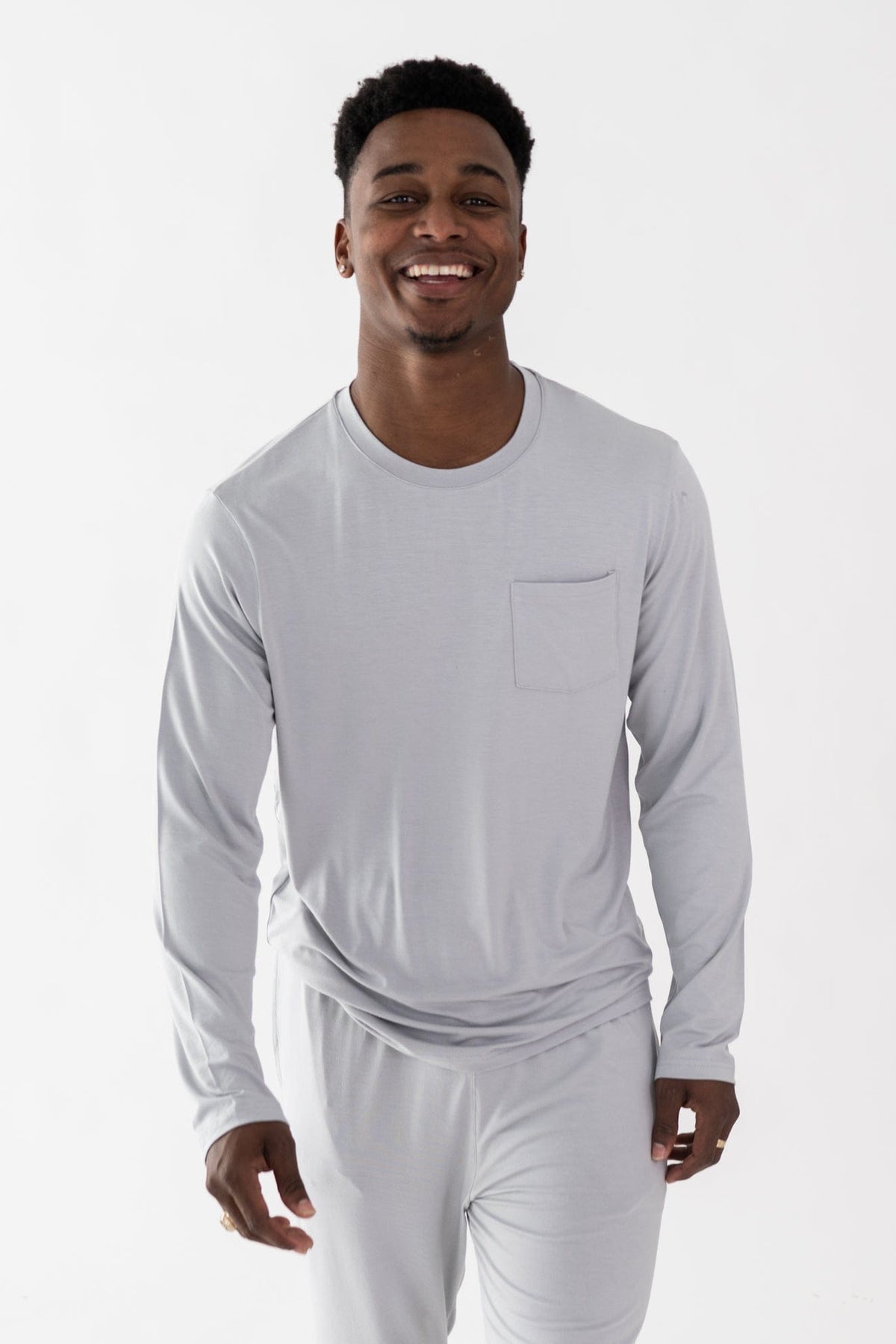 Man wearing Kyte Baby bamboo men's jogger set in Storm