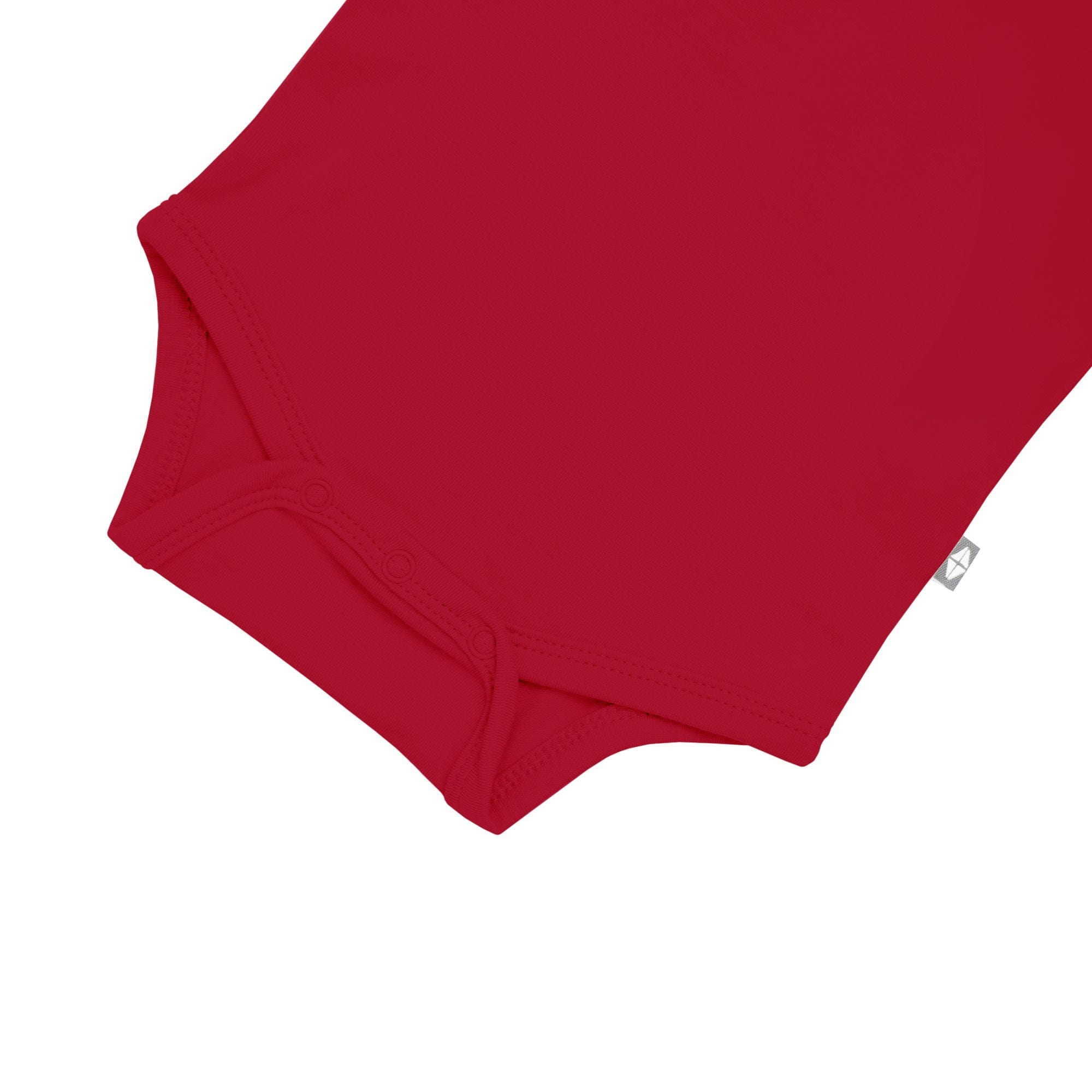 Snap bottom of Kyte Baby bamboo infant Bodysuit in Cardinal