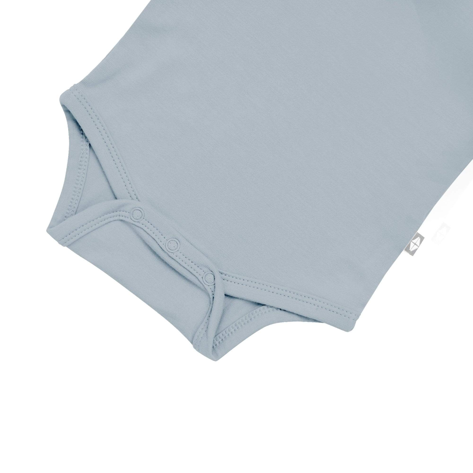 Snap bottom of Kyte Baby Sleeveless Bodysuit in Fog