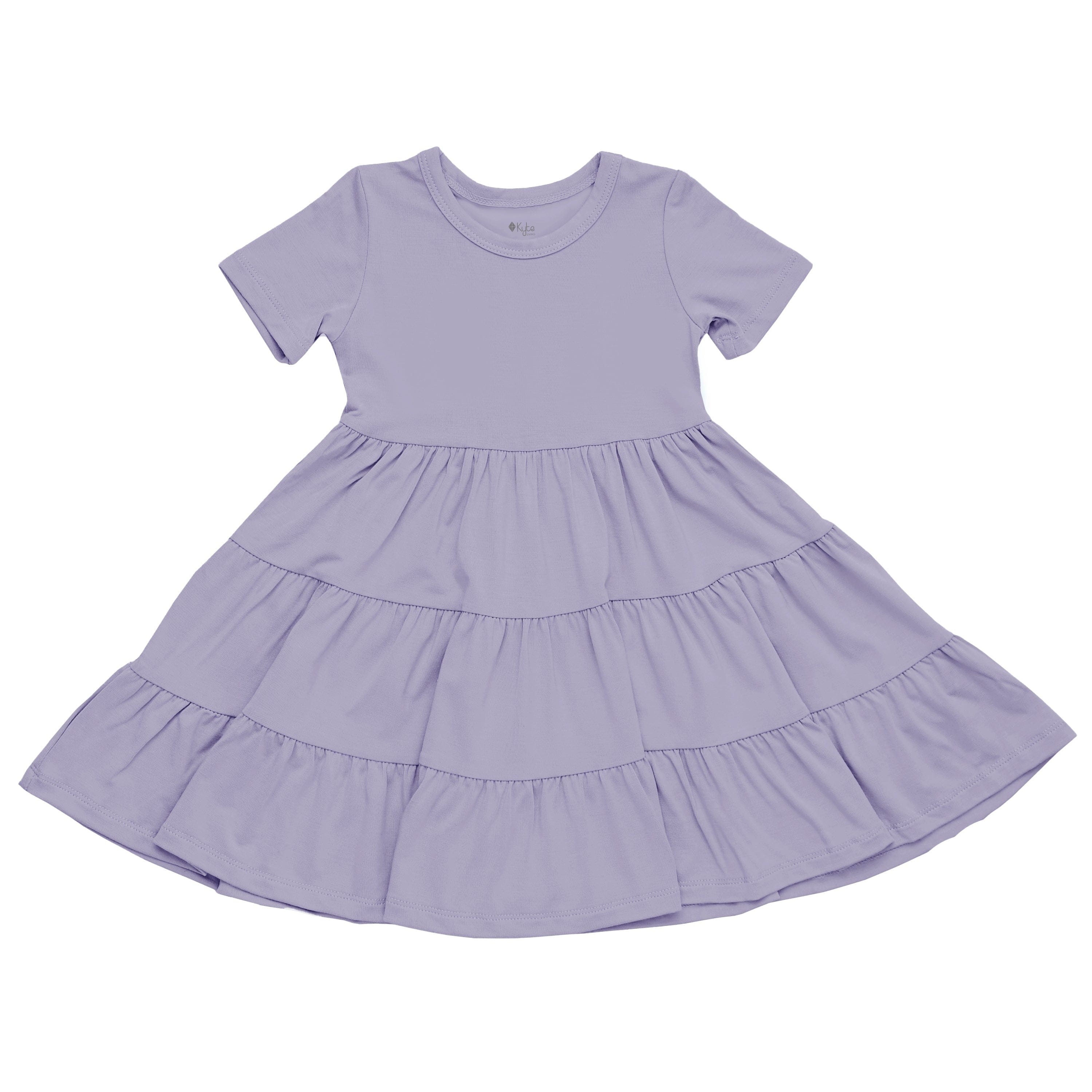 Flat lay of Kyte Baby Short Sleeve Tiered Dress in Taro