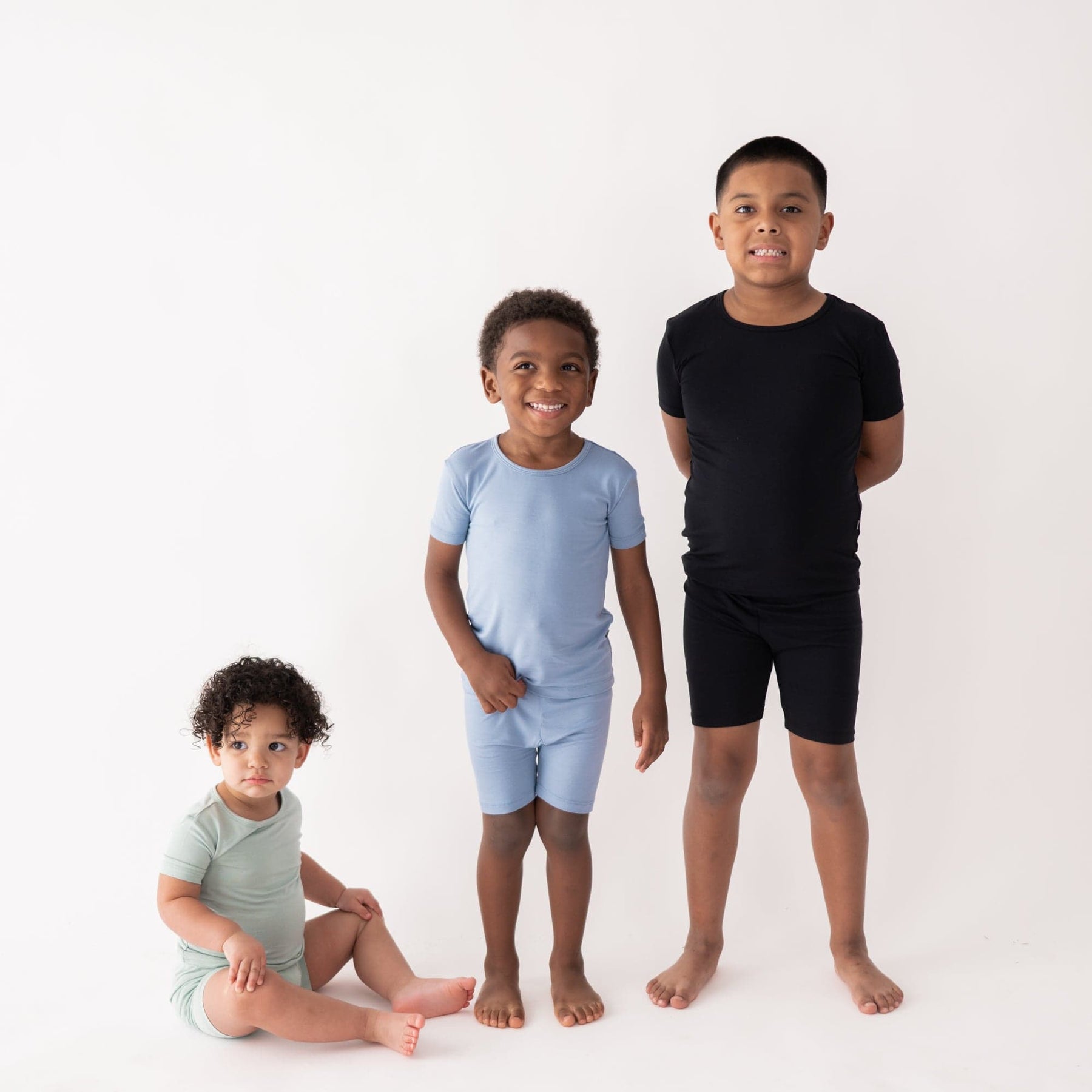Kids wearing Kyte Baby short sleeve pajama sets for children