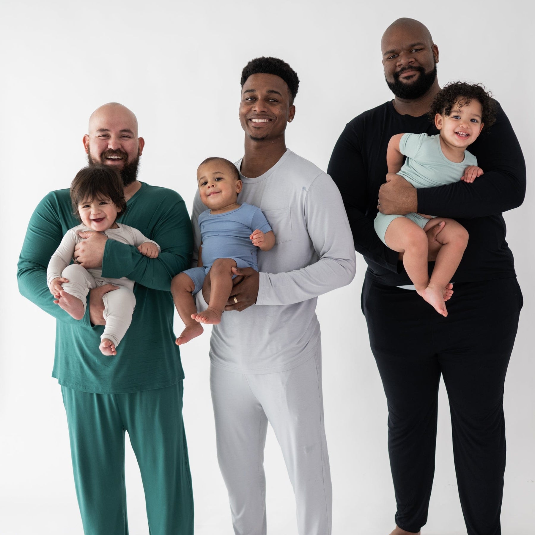 Dad's with their kids wearing Kyte Baby short sleeve pajamas