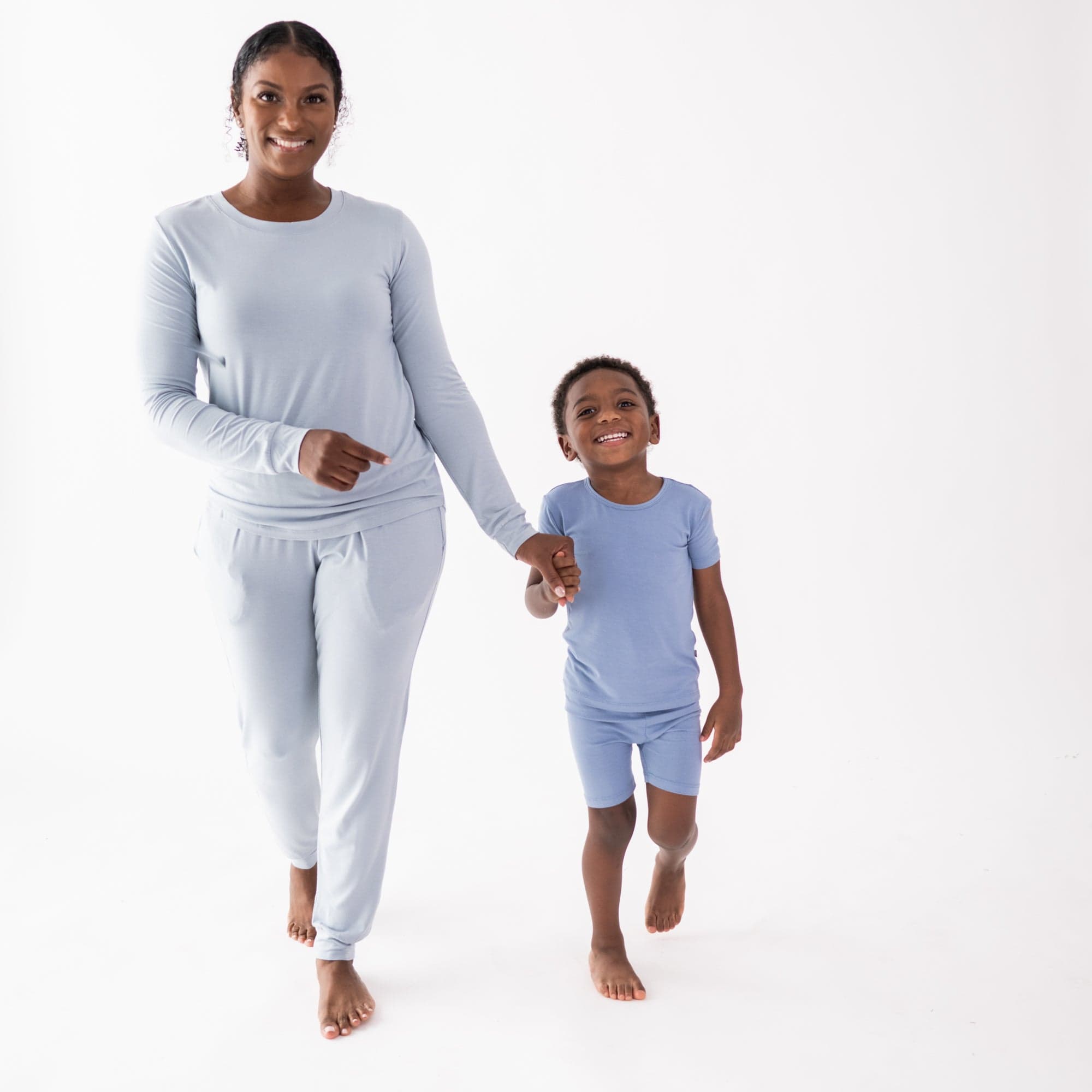 Mom and child wearing Kyte Baby coordinating bamboo pajamas