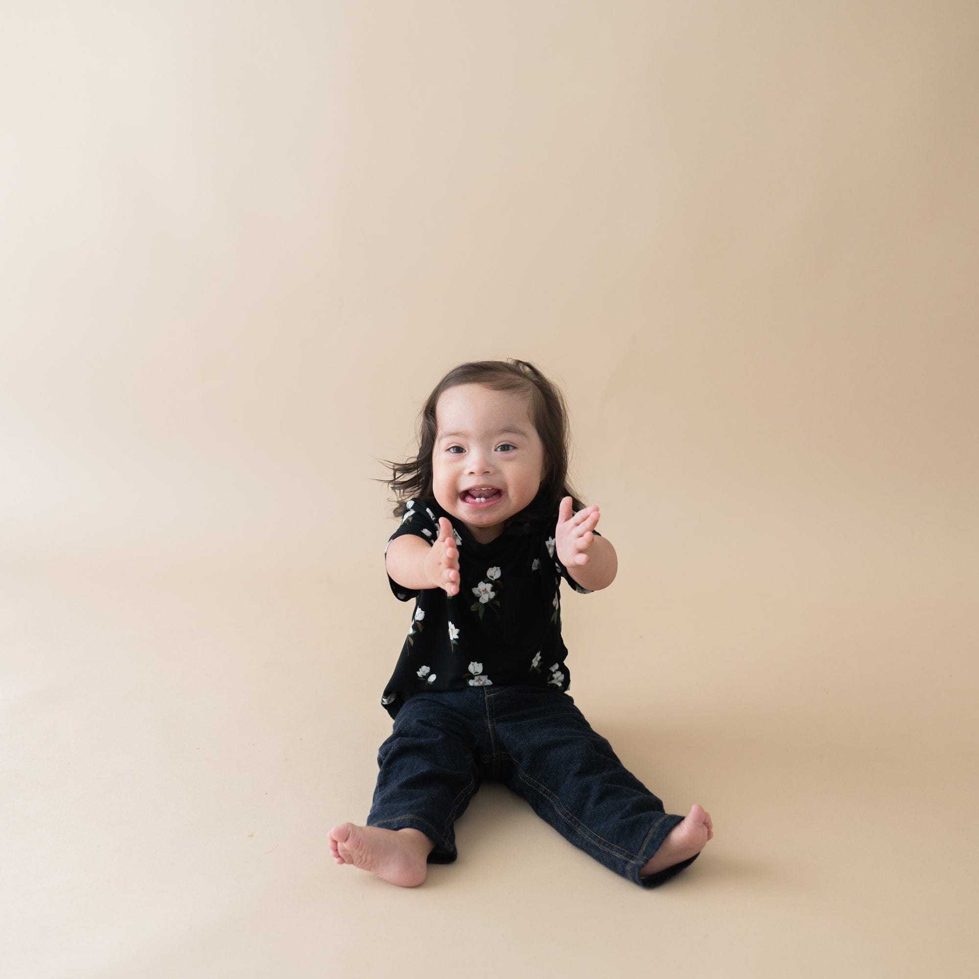 Child wearing Kyte Baby Toddler Crew Neck Tee in Small Midnight Magnolia